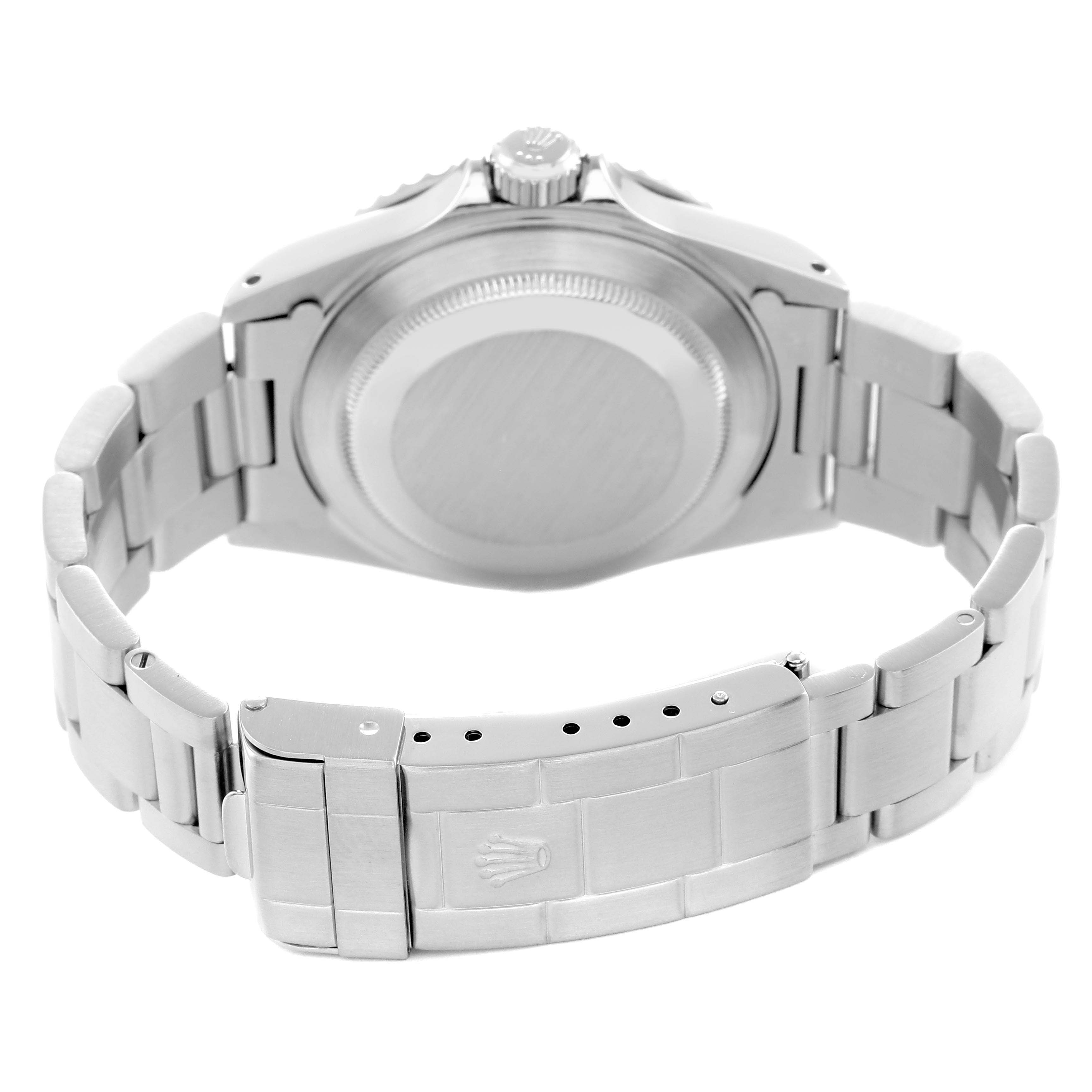 The image shows the back view of a Rolex Submariner model number 14060, highlighting the case back, bracelet, and clasp.