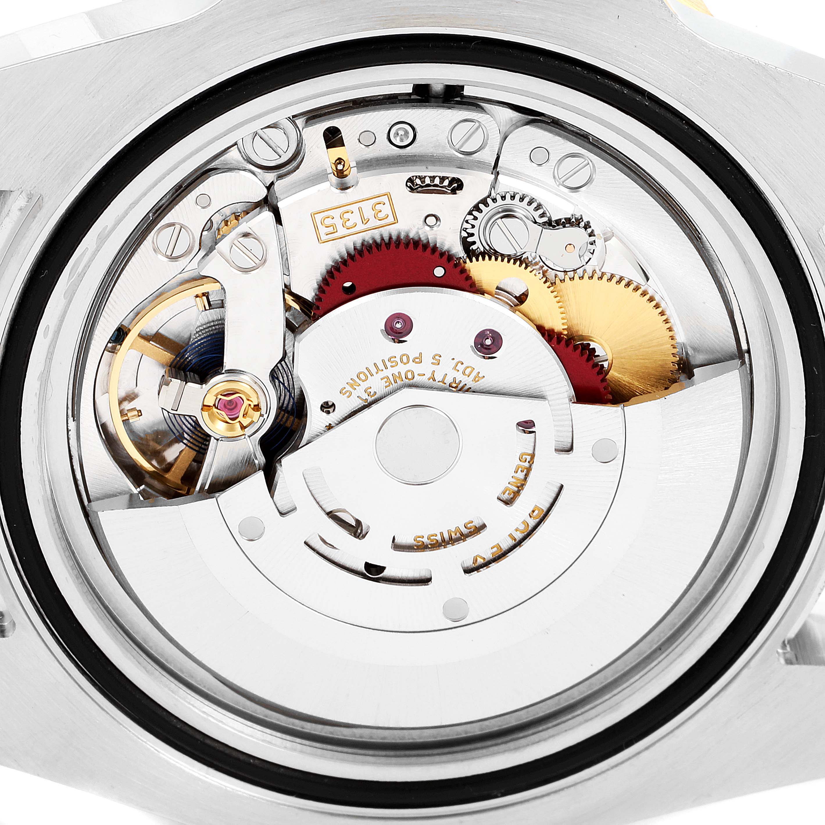 This image shows the intricate internal mechanical movement of a Rolex Submariner 116613 Men's Steel and Gold (two tone) Blue Dial 116613 Men's Steel and Gold (two tone) Blue Dial watch from a close-up angle.