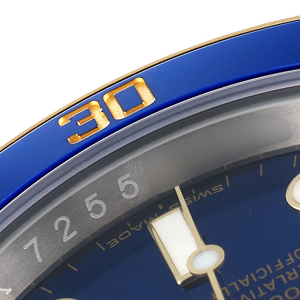 The image shows a close-up of the bezel and dial of a Rolex Submariner 116613 Men's Steel and Gold (two tone) Blue Dial 116613 Men's Steel and Gold (two tone) Blue Dial watch, highlighting the number 30 and part of the minute markings.