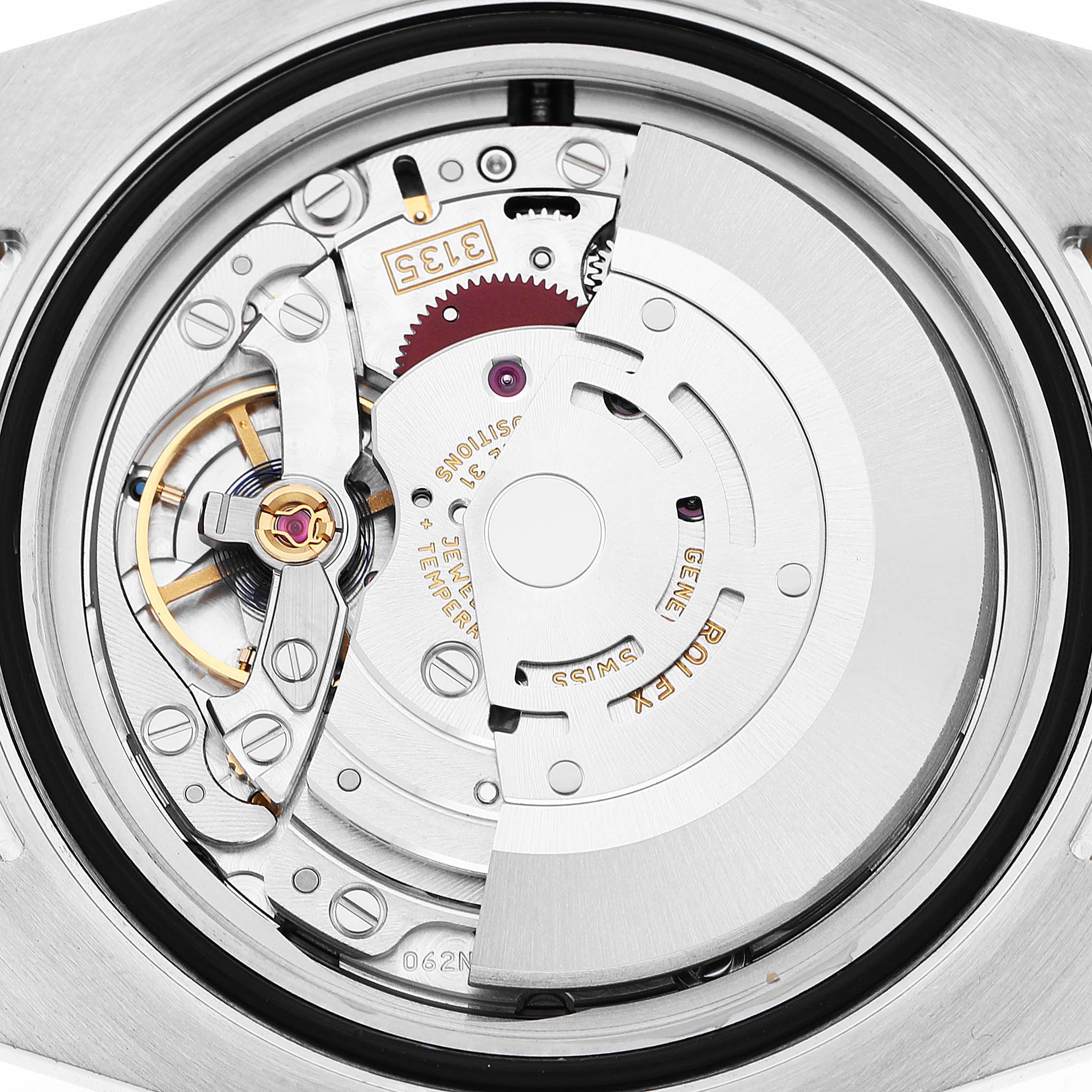 The image shows the movement of the Rolex Submariner 116613 Men's Steel and Gold (two tone) Black Dial watch, viewed from the back, highlighting its intricate mechanical parts.