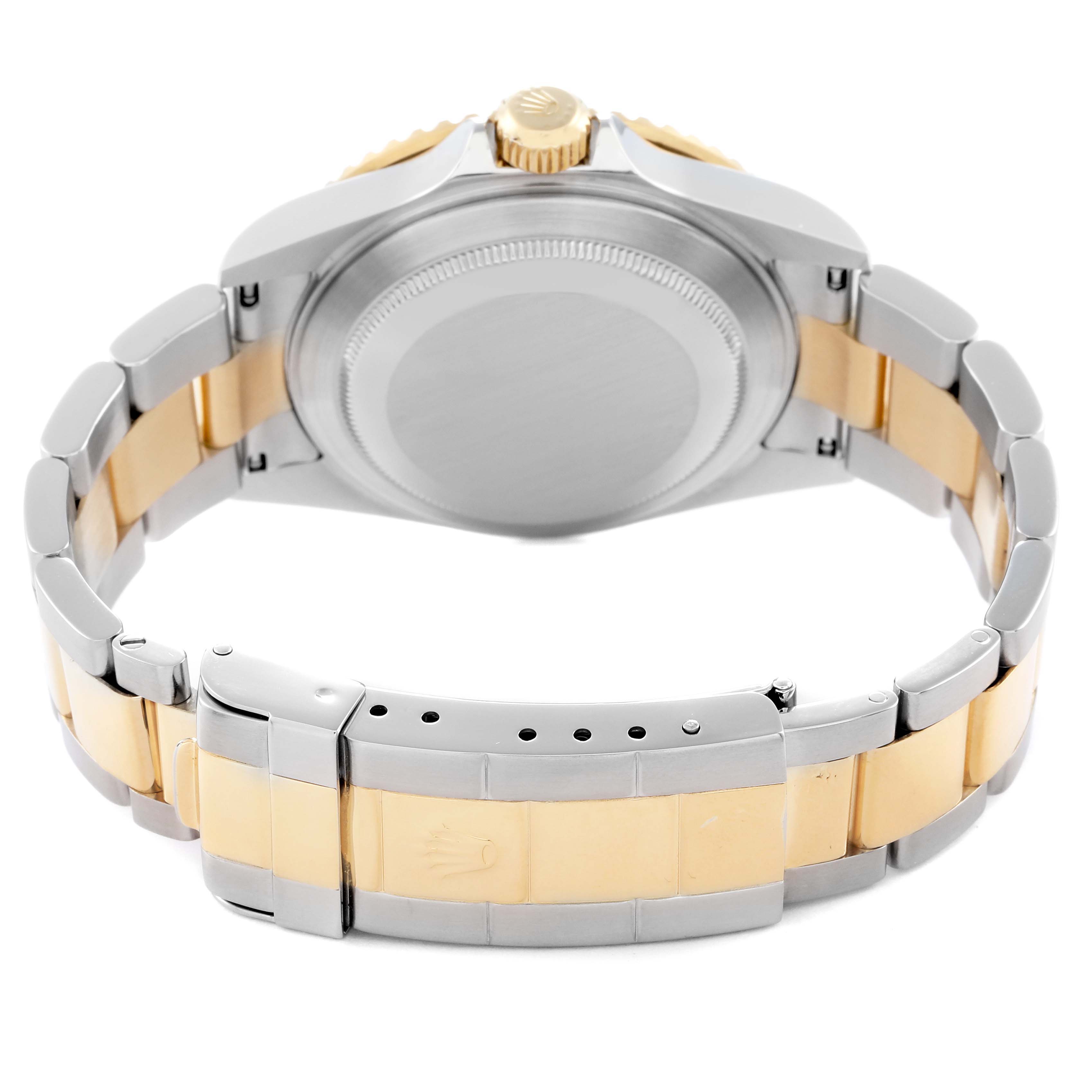 The image shows the back view of a Rolex Submariner model 16613, highlighting its case back, bracelet, and clasp.