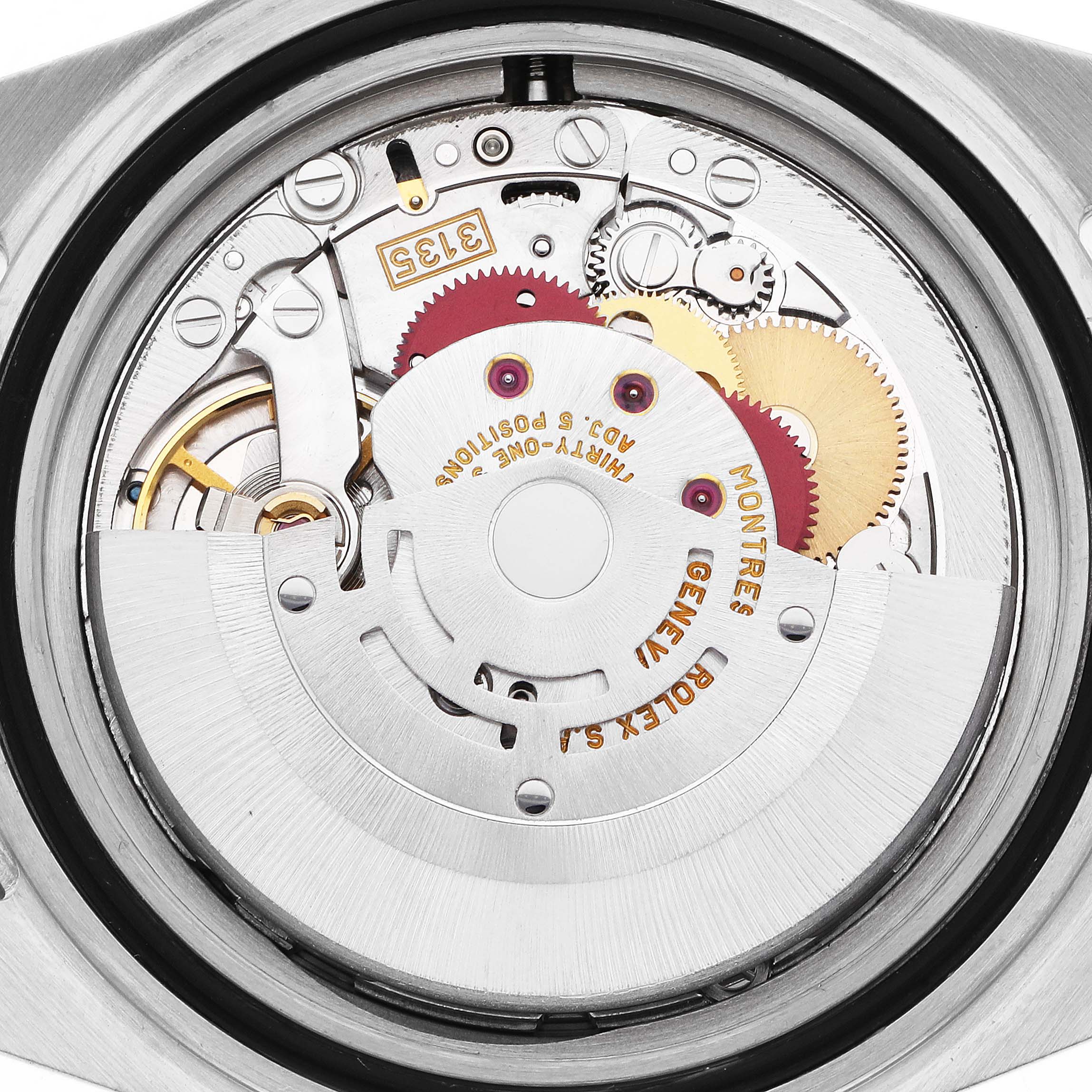 The image shows the movement of the Rolex Submariner model 16613 from the back, detailing the gears and mechanisms inside the watch case.