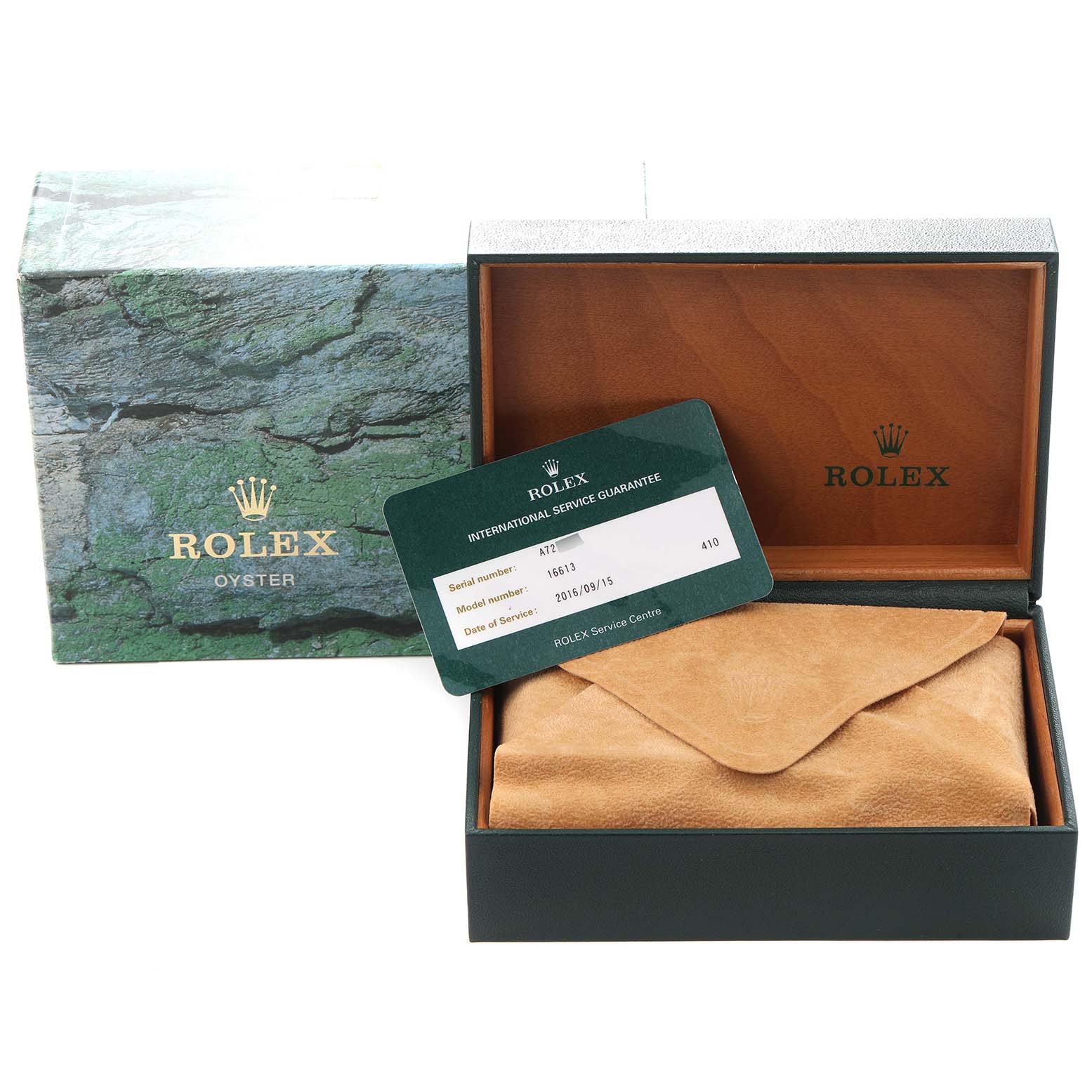The image shows a Rolex Submariner model 16613 box, an international service guarantee card, and a watch pouch displayed at a slight angle.