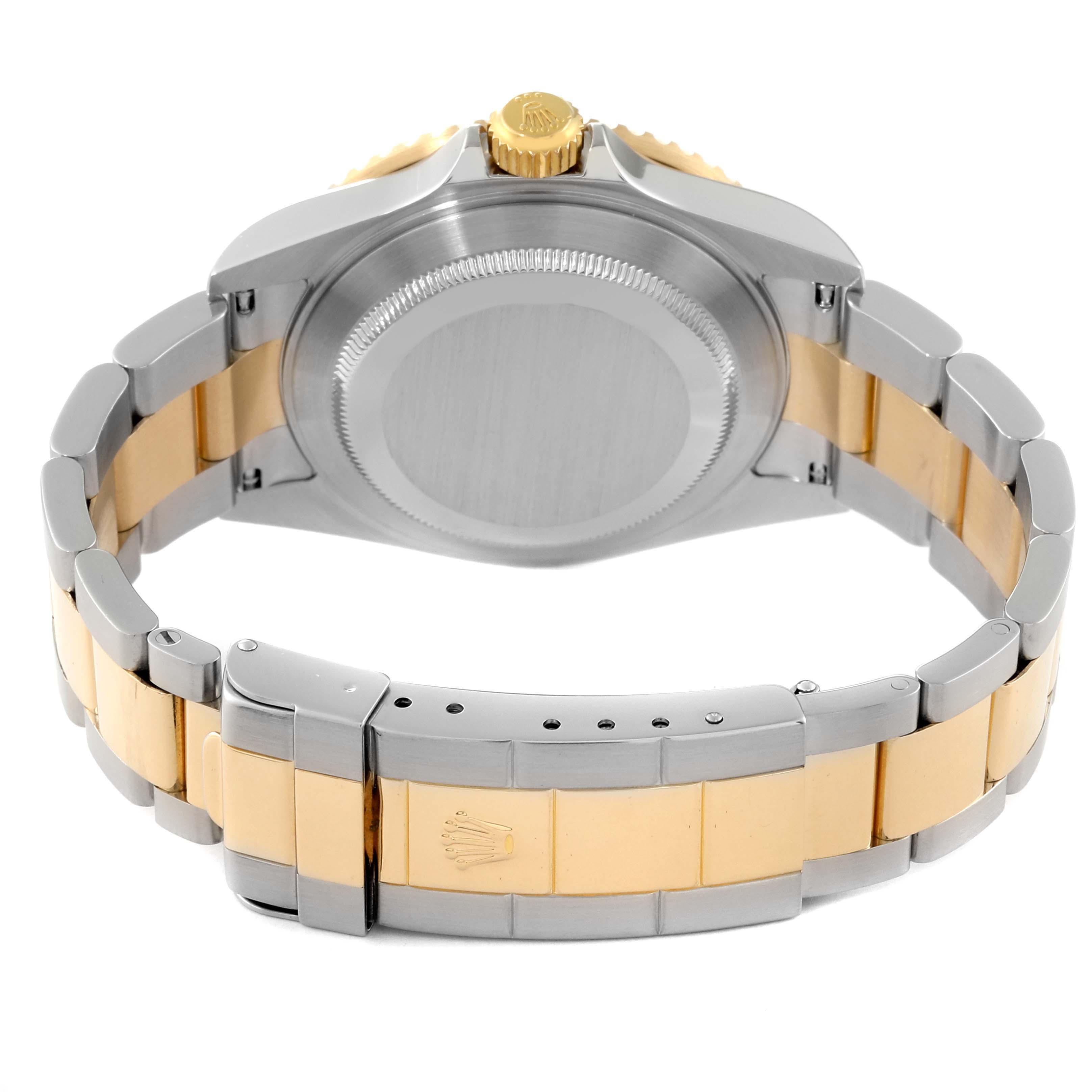 The image shows the back view of the Rolex Submariner 16613 Men's Steel and Gold (two tone) Grey Dial 16613 Men's Steel and Gold (two tone) Grey Dial watch, highlighting the case back, crown, and two-tone bracelet with clasp.