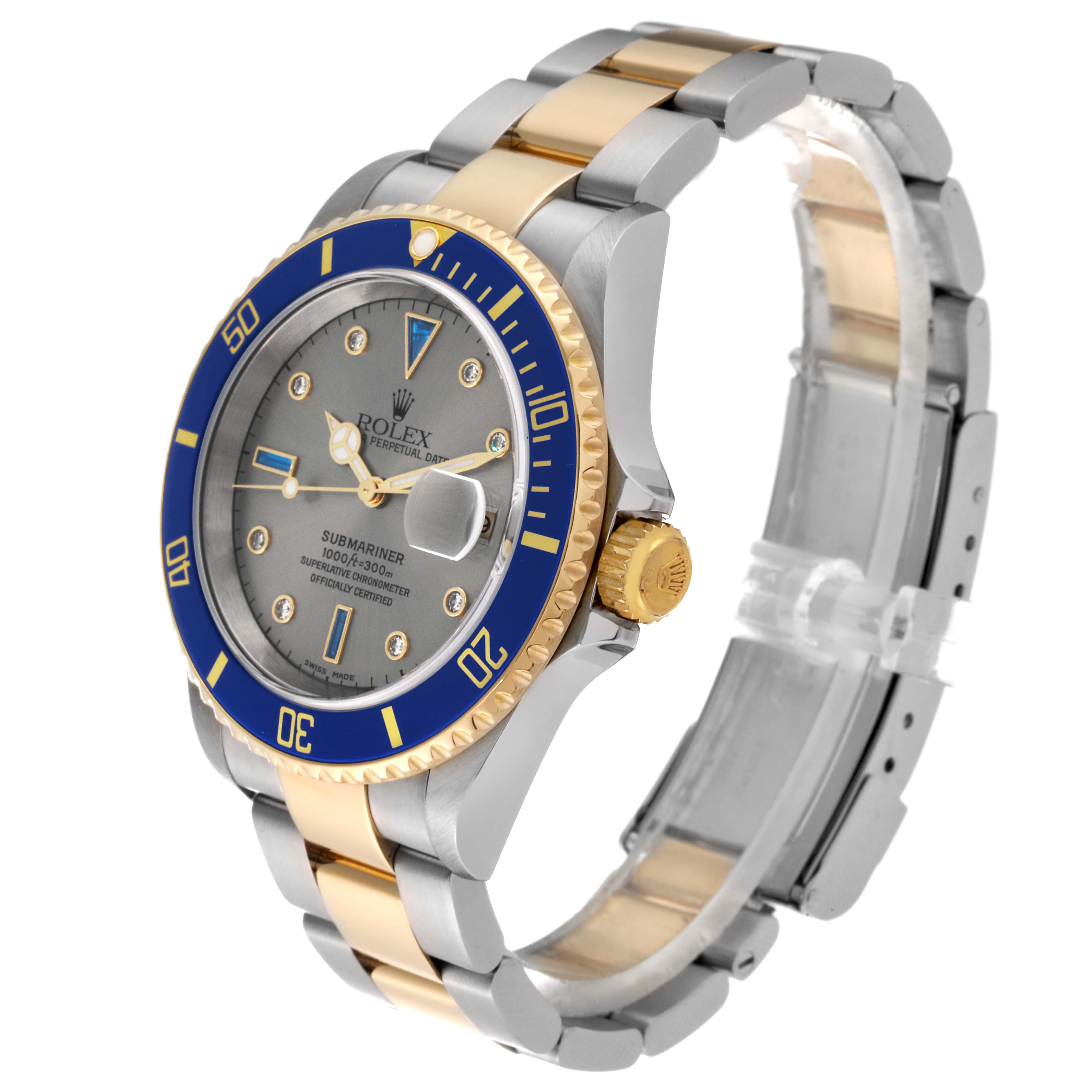 The Rolex Submariner 16613 Men's Steel and Gold (two tone) Grey Dial 16613 Men's Steel and Gold (two tone) Grey Dial watch is pictured at an angle showing its blue bezel, dial, case, and two-tone bracelet.
