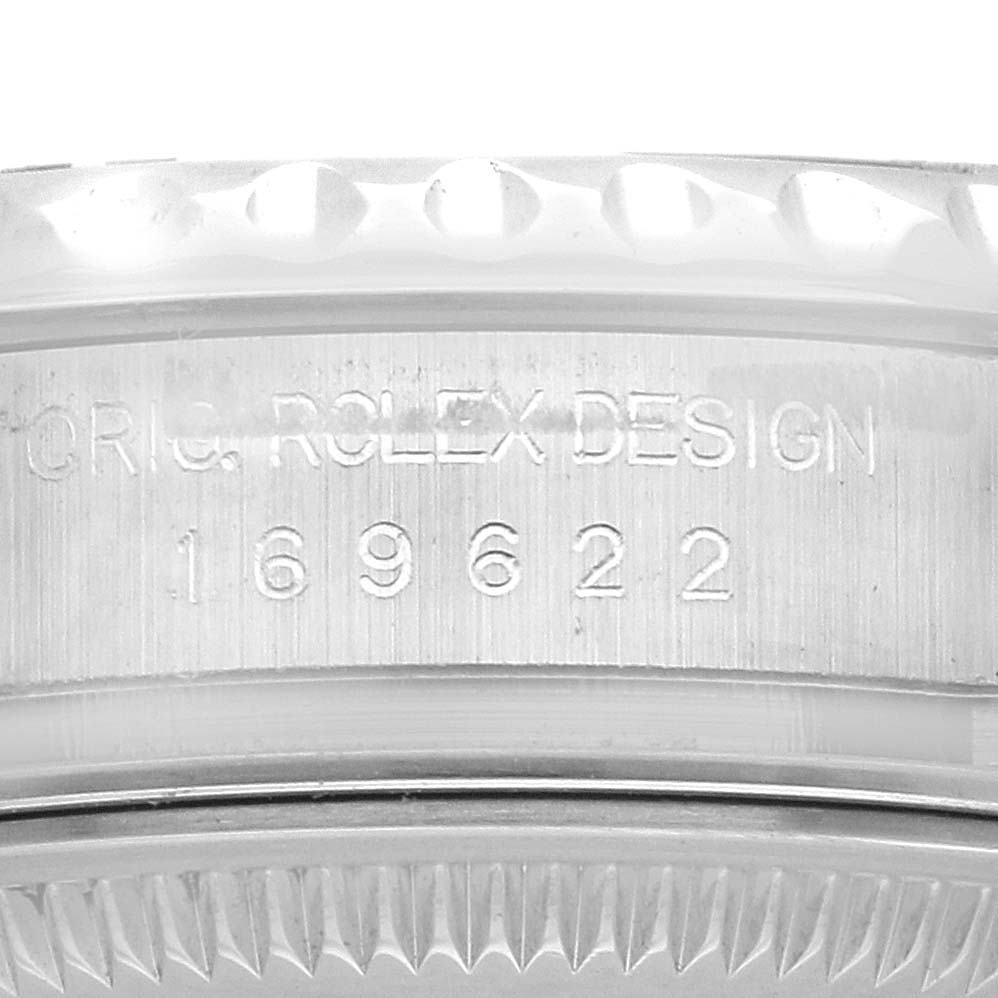 The image shows a close-up of the side of a Rolex Yacht-Master model 169622, focusing on the engraved design and model number.