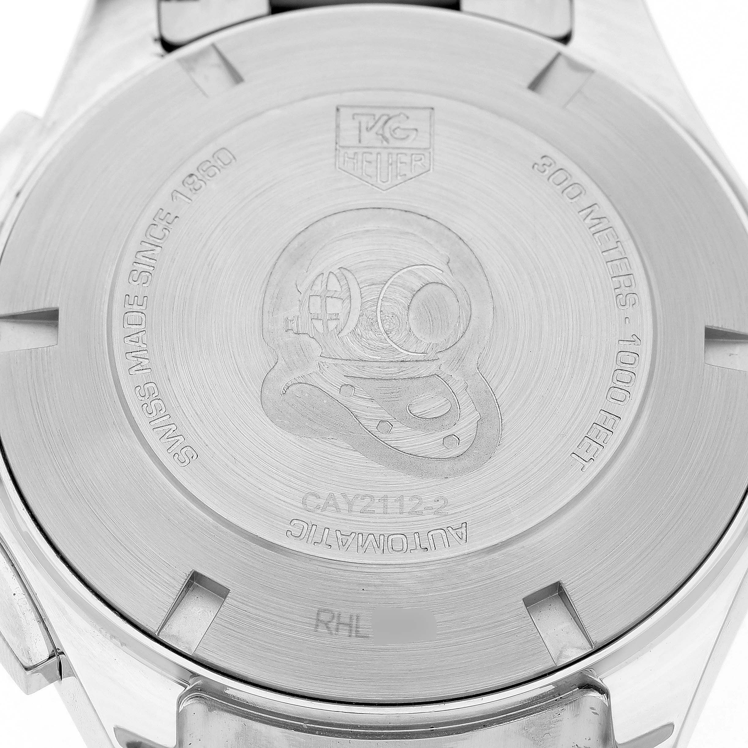 The image shows the back case of a Tag Heuer Aquaracer CAY2112.BA0927 Men's Stainless Steel Blue Dial watch, featuring engraved details and branding.