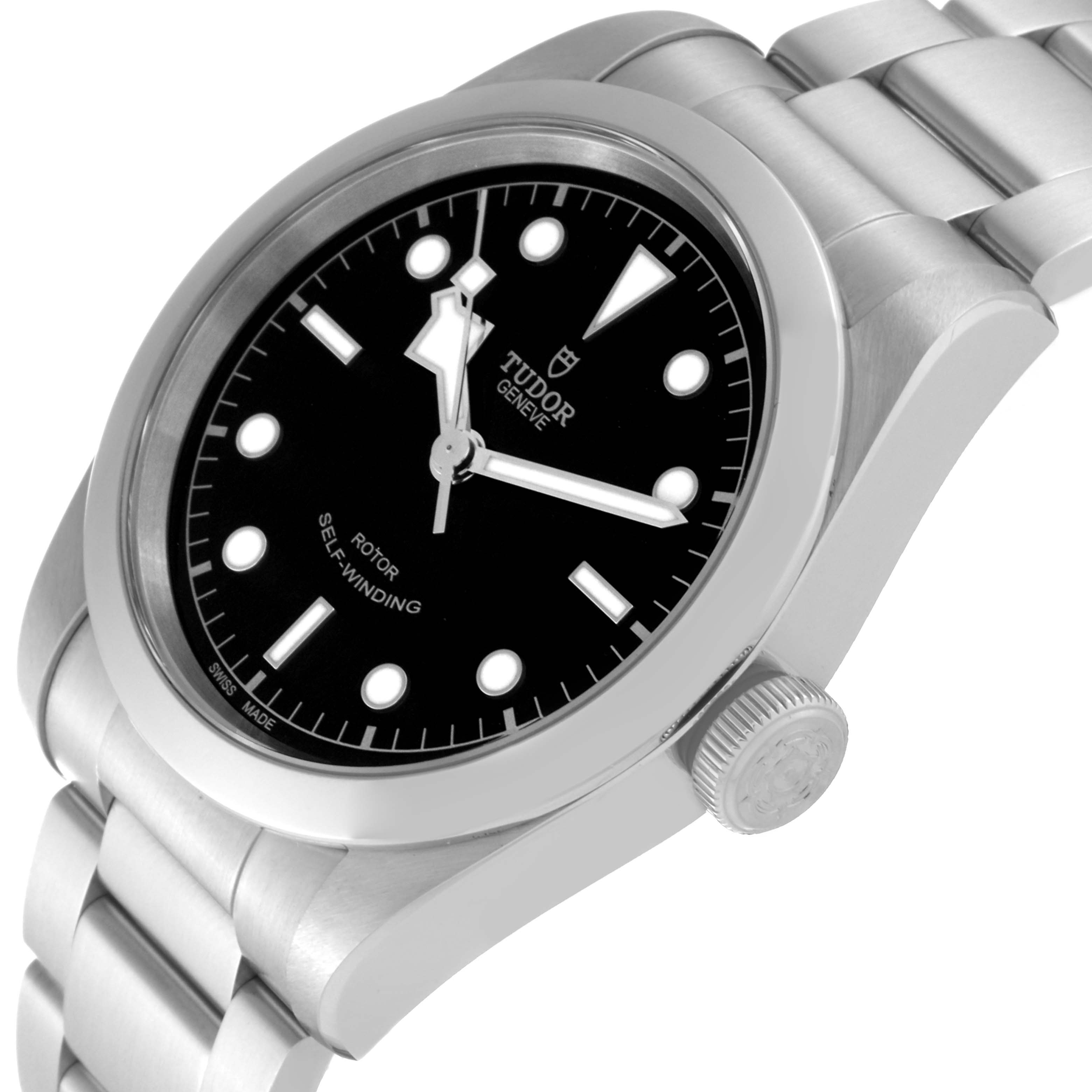 The image shows a side angle of the Tudor Heritage Black Bay 79540 Men's Stainless Steel Black Dial 79540 Men's Stainless Steel Black Dial watch, highlighting its black dial, crown, and stainless steel bracelet.