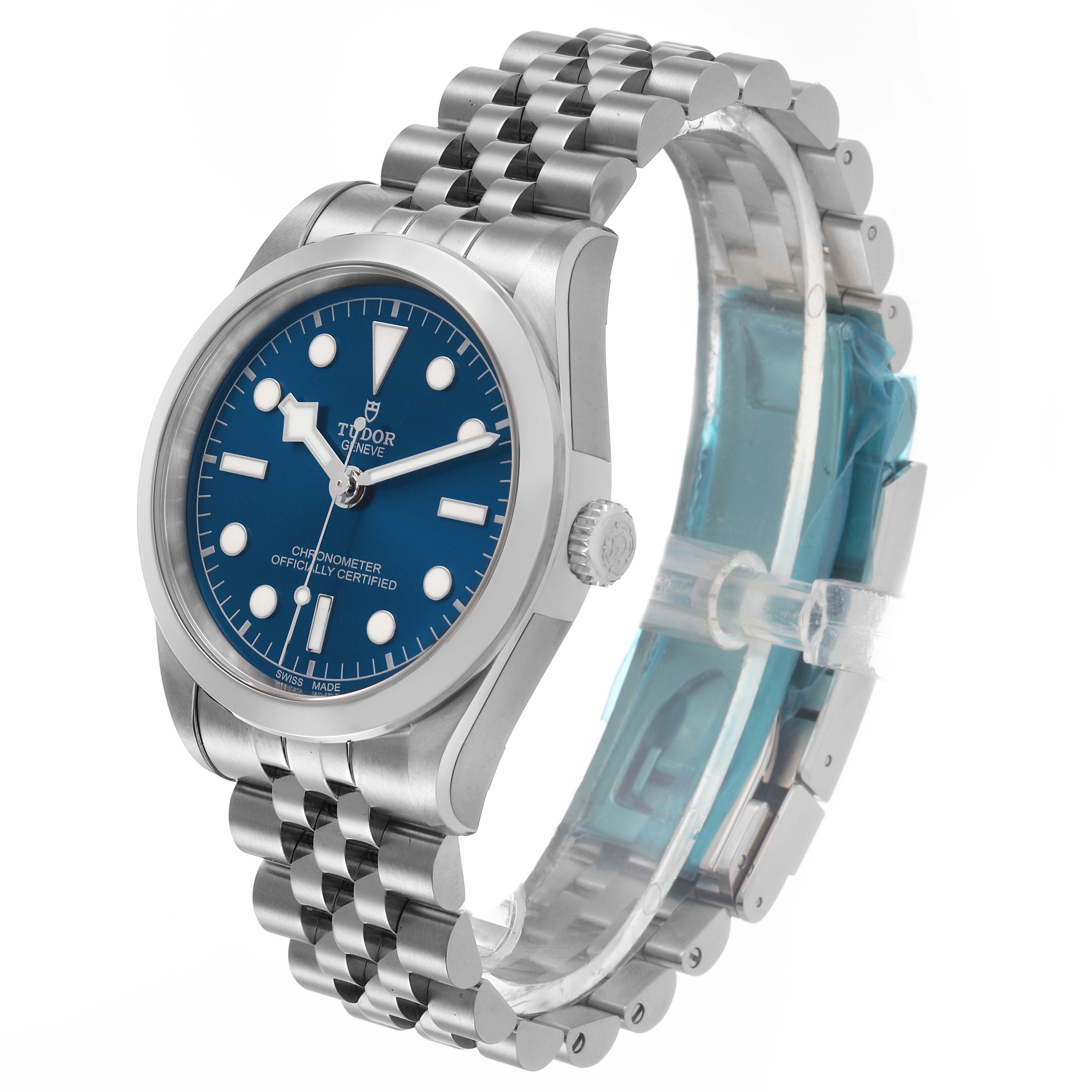 The Tudor Heritage Black Bay 79640 Men's Stainless Steel Blue Dial watch is shown at a three-quarter angle, highlighting the dial, bezel, crown, and bracelet.