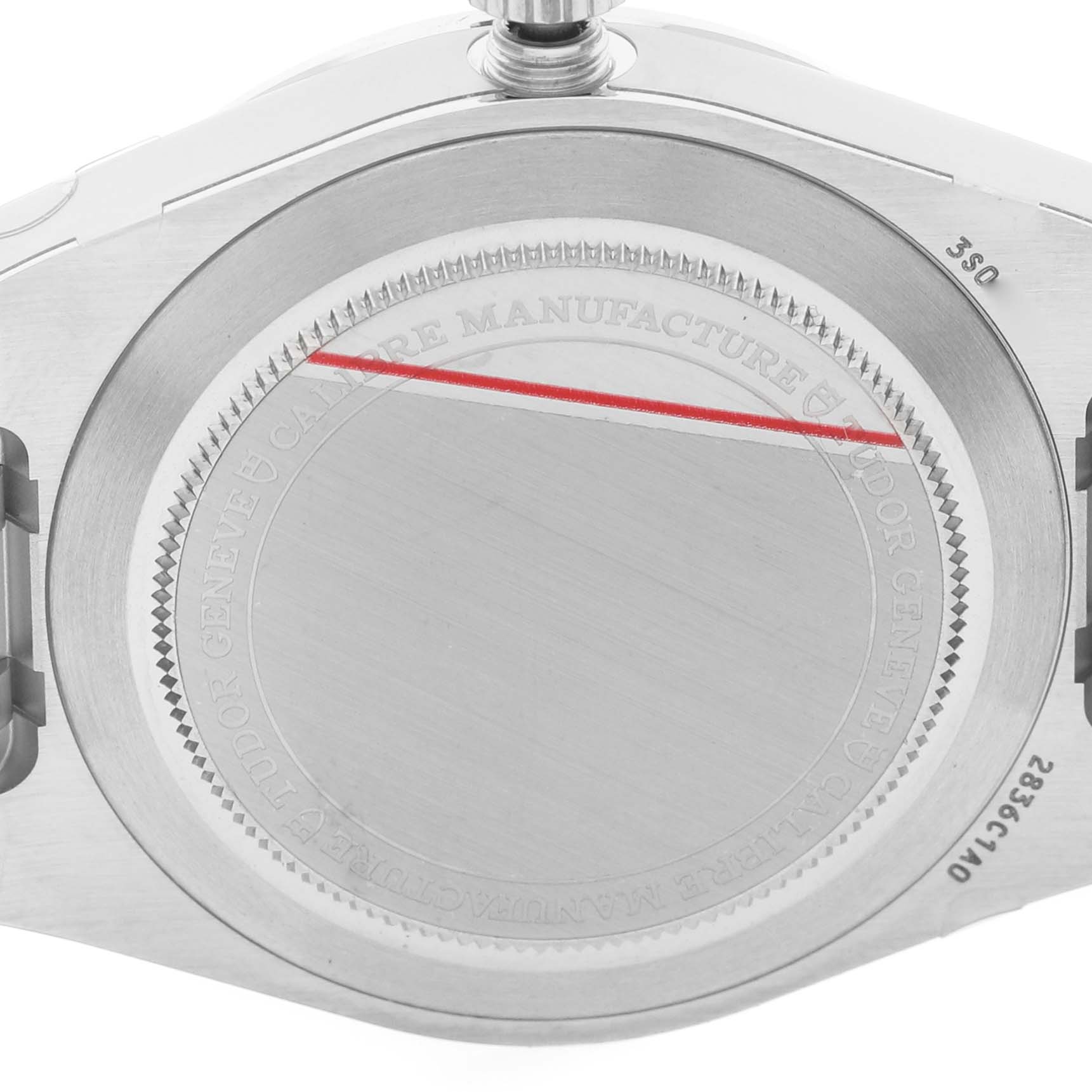 The image shows the back case of a Tudor Royal 2836C1A0 Men's Stainless Steel Silver Dial watch, highlighting its textured edge and engraved details.