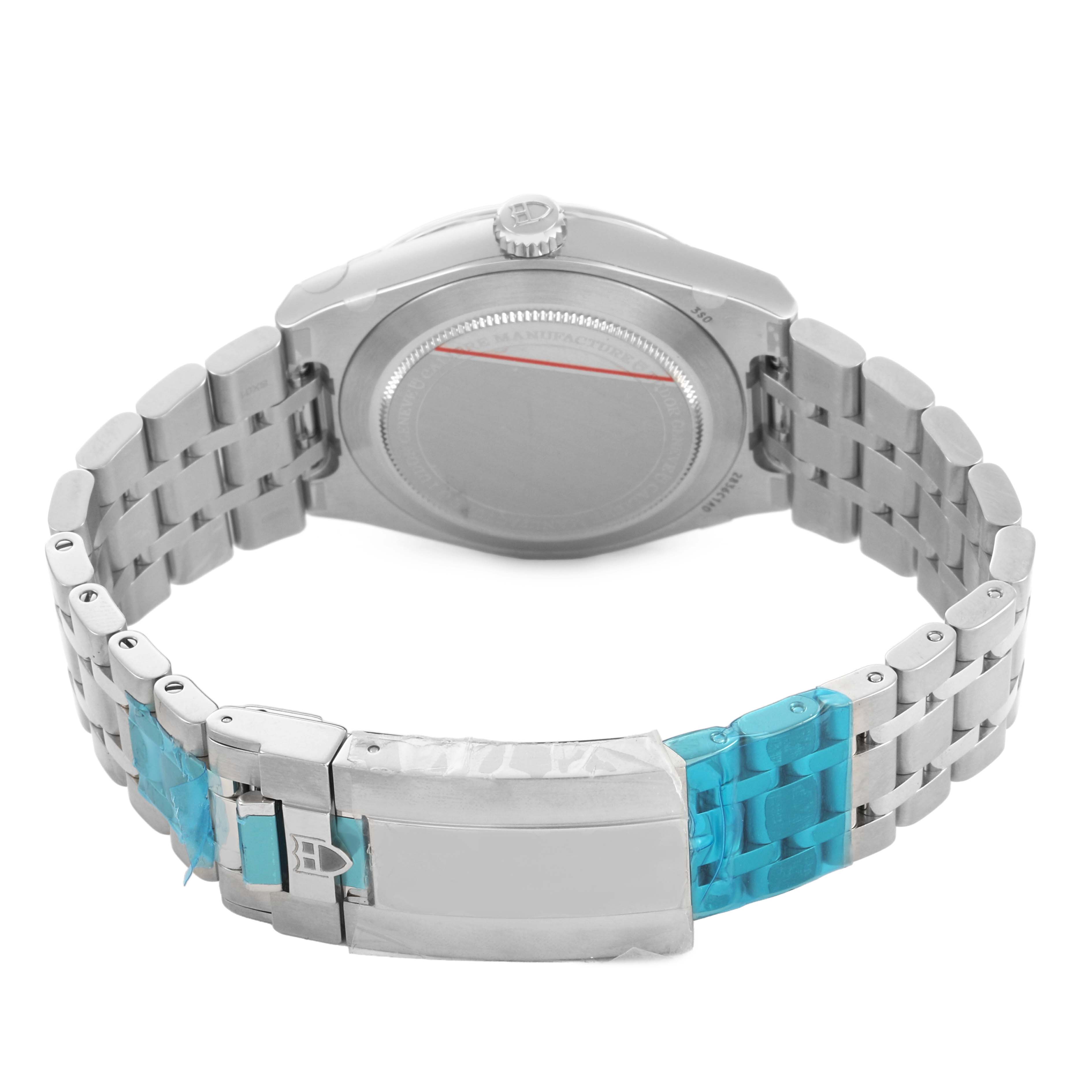 The image shows the back view of a Tudor Royal 2836C1A0 Men's Stainless Steel Silver Dial model watch, highlighting the case back, crown, and clasp of the metal bracelet.