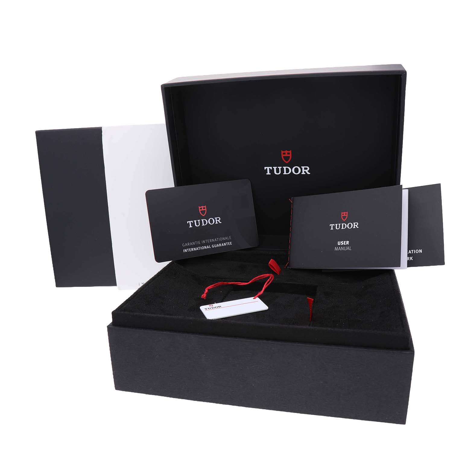 The image shows a Tudor Royal 2836C1A0 Men's Stainless Steel Silver Dial package with a box, warranty card, user manual, and tags displayed at a frontal angle.