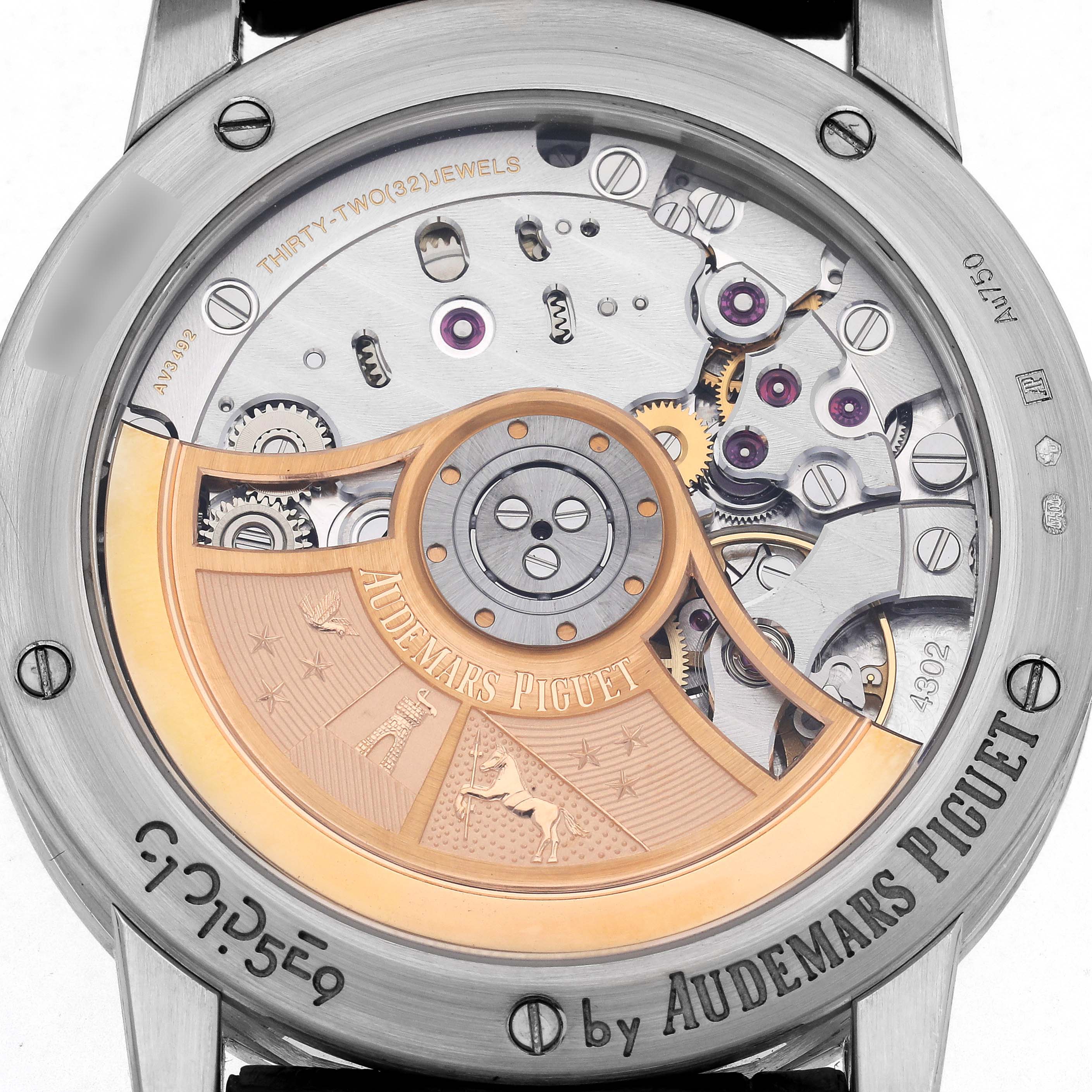 The image shows the back view of an Audemars Piguet Jules model number 15210BC men's watch, highlighting its detailed mechanical movement and rotor.