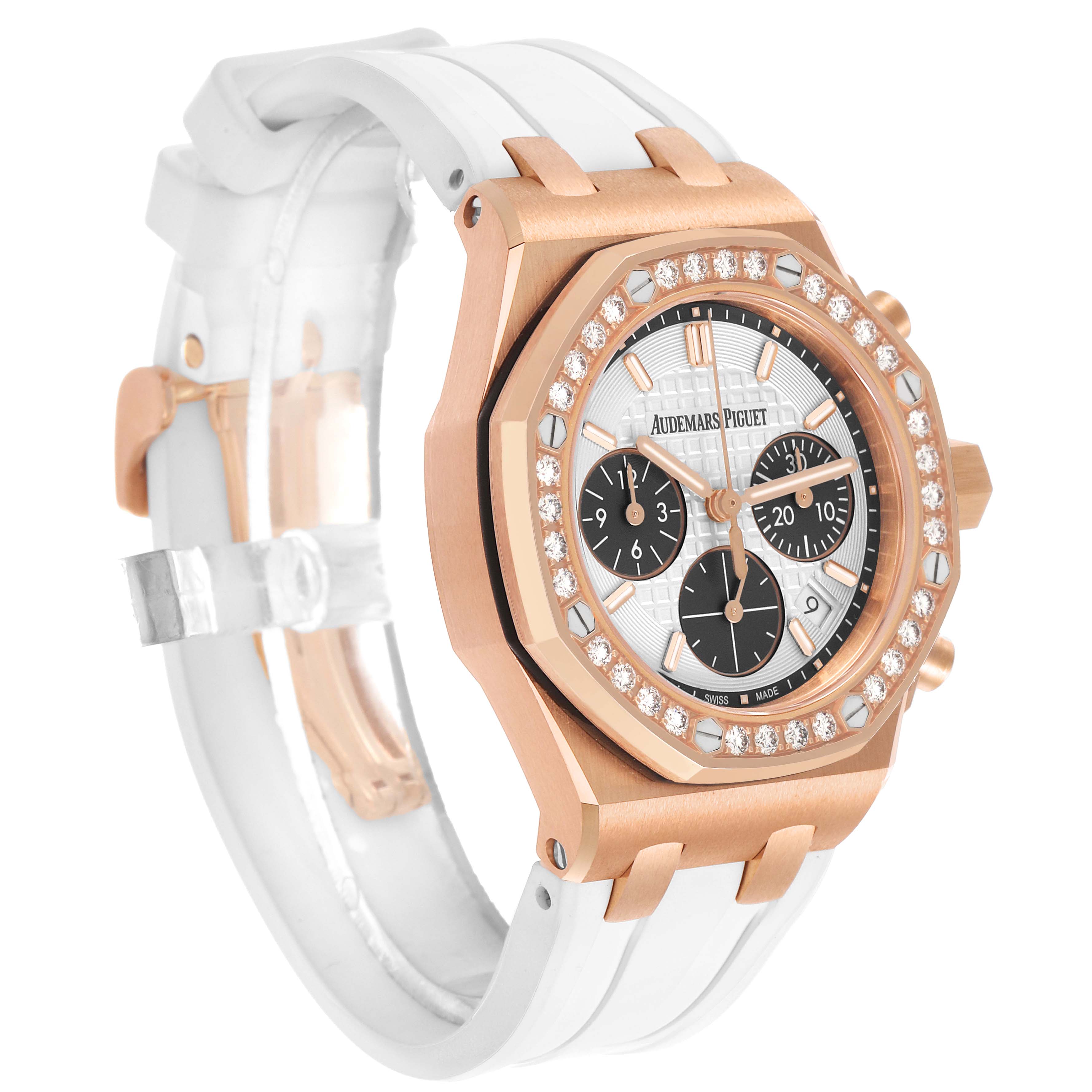 The Audemars Piguet Royal Oak Offshore 26231OR Women's Rose Gold Silver Dial is shown at a three-quarter angle, highlighting its rose gold case, diamond-set bezel, and white strap.