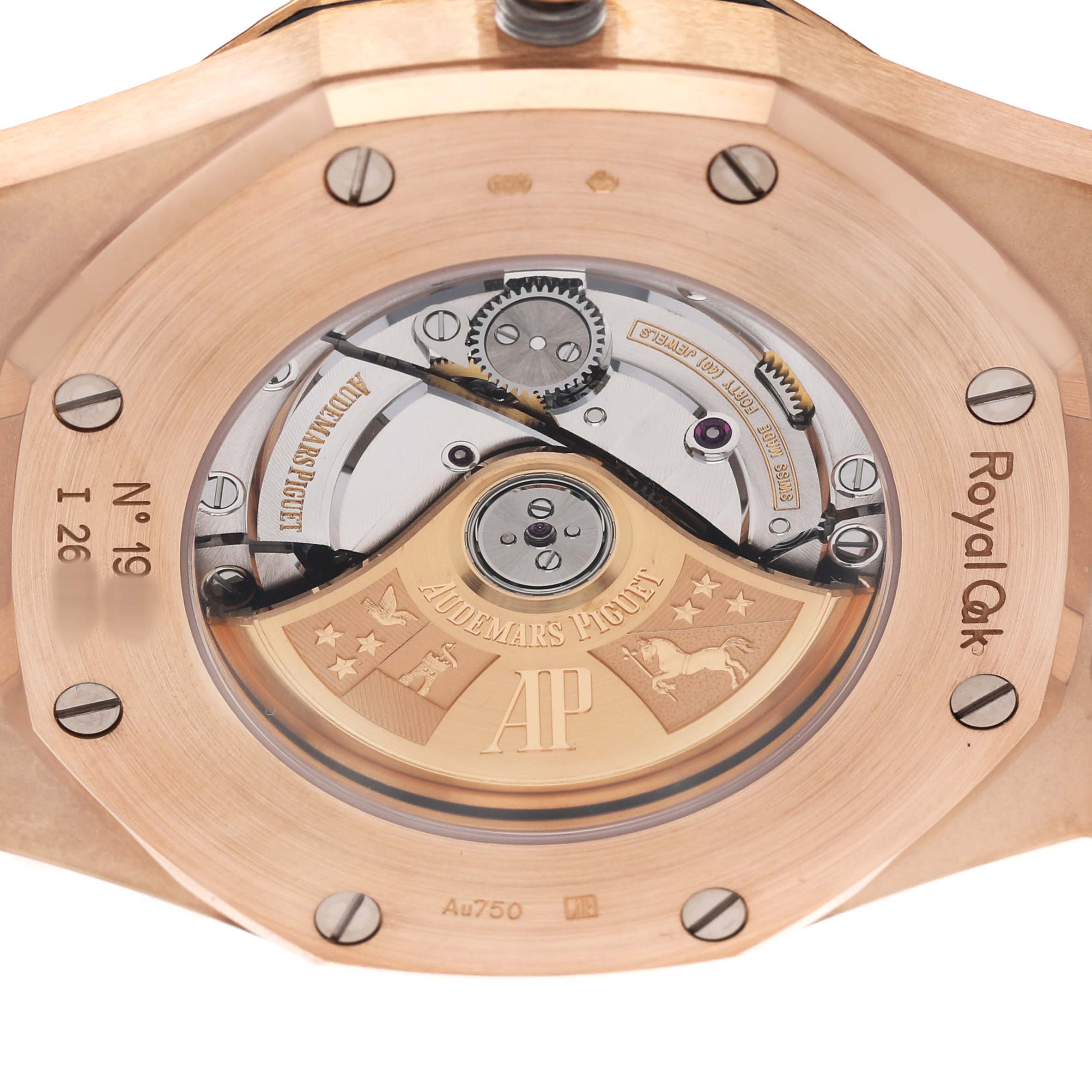 The image shows the back of an Audemars Piguet Royal Oak 154000R.00.D0002OR.01 Men's Rose Gold Black Dial watch, highlighting its movement and rotor.