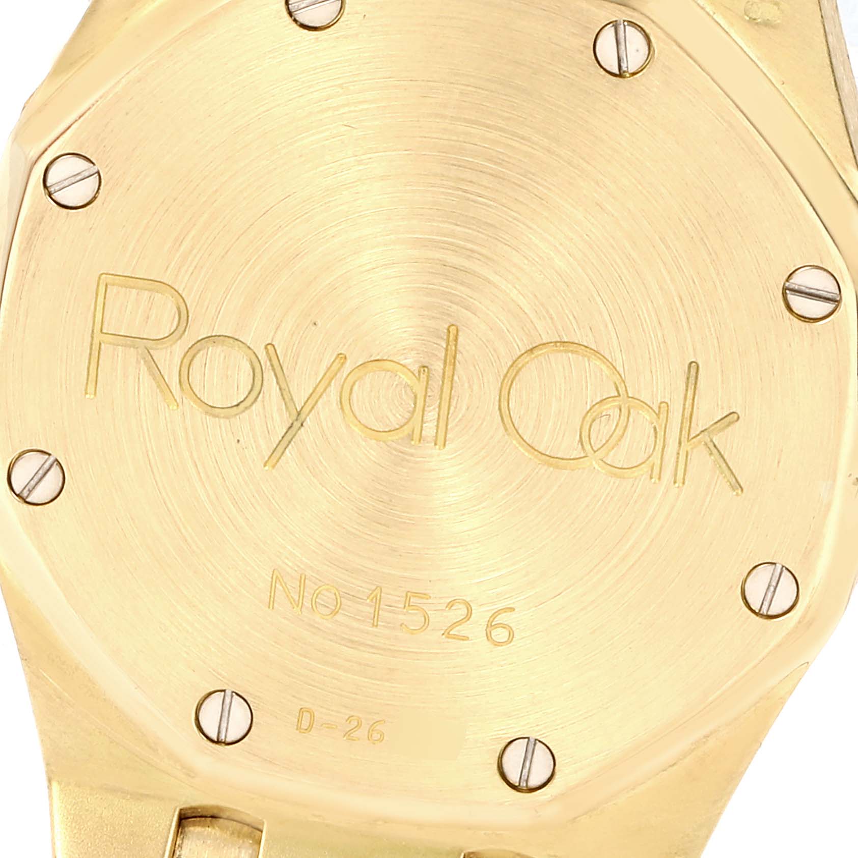 This image shows the back plate of a Royal Oak model by Audemars Piguet, with visible screws and engraved text and numbers.