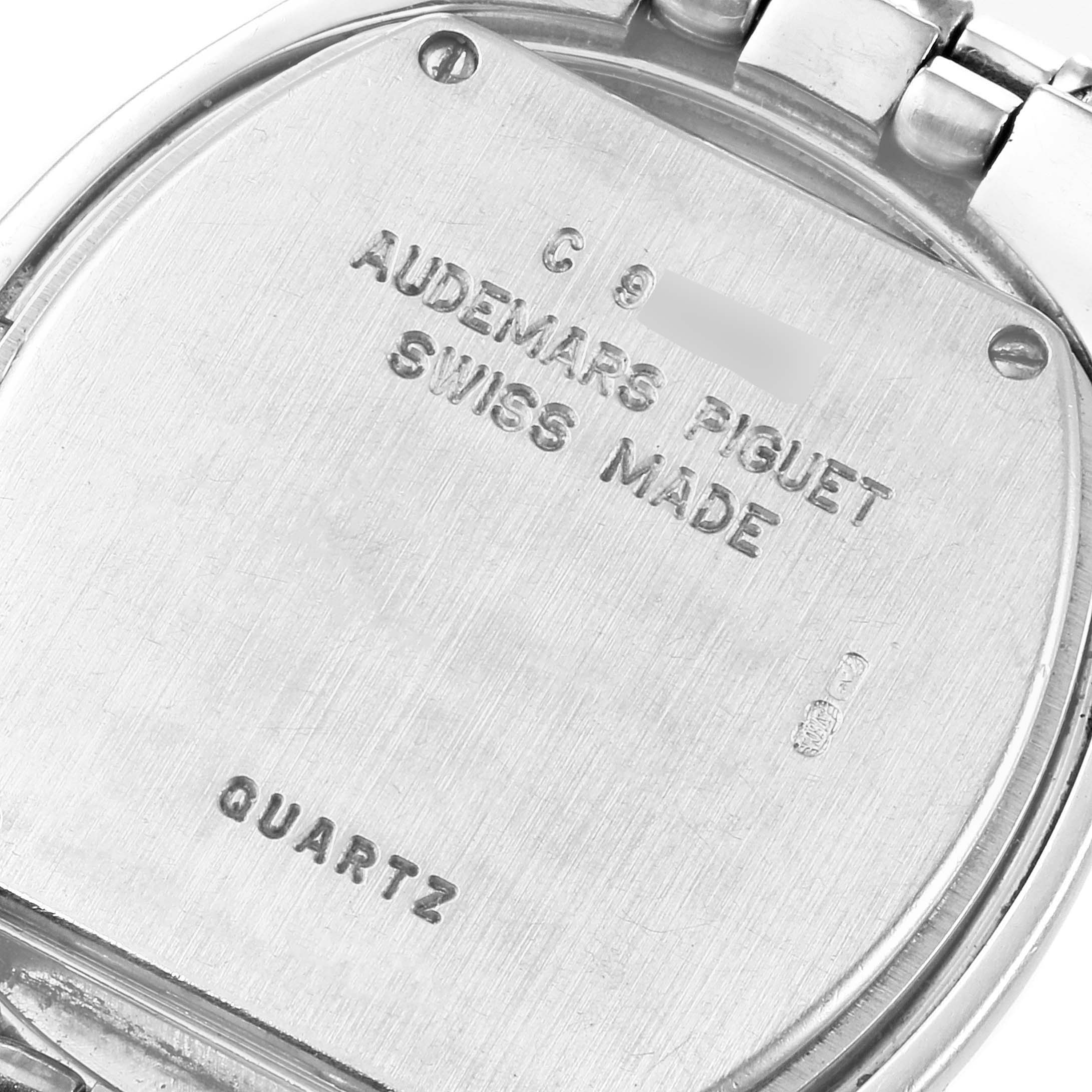 The image shows the back case of a Vintage Audemars Piguet watch, highlighting its brand, "Swiss Made" inscription, and quartz movement.