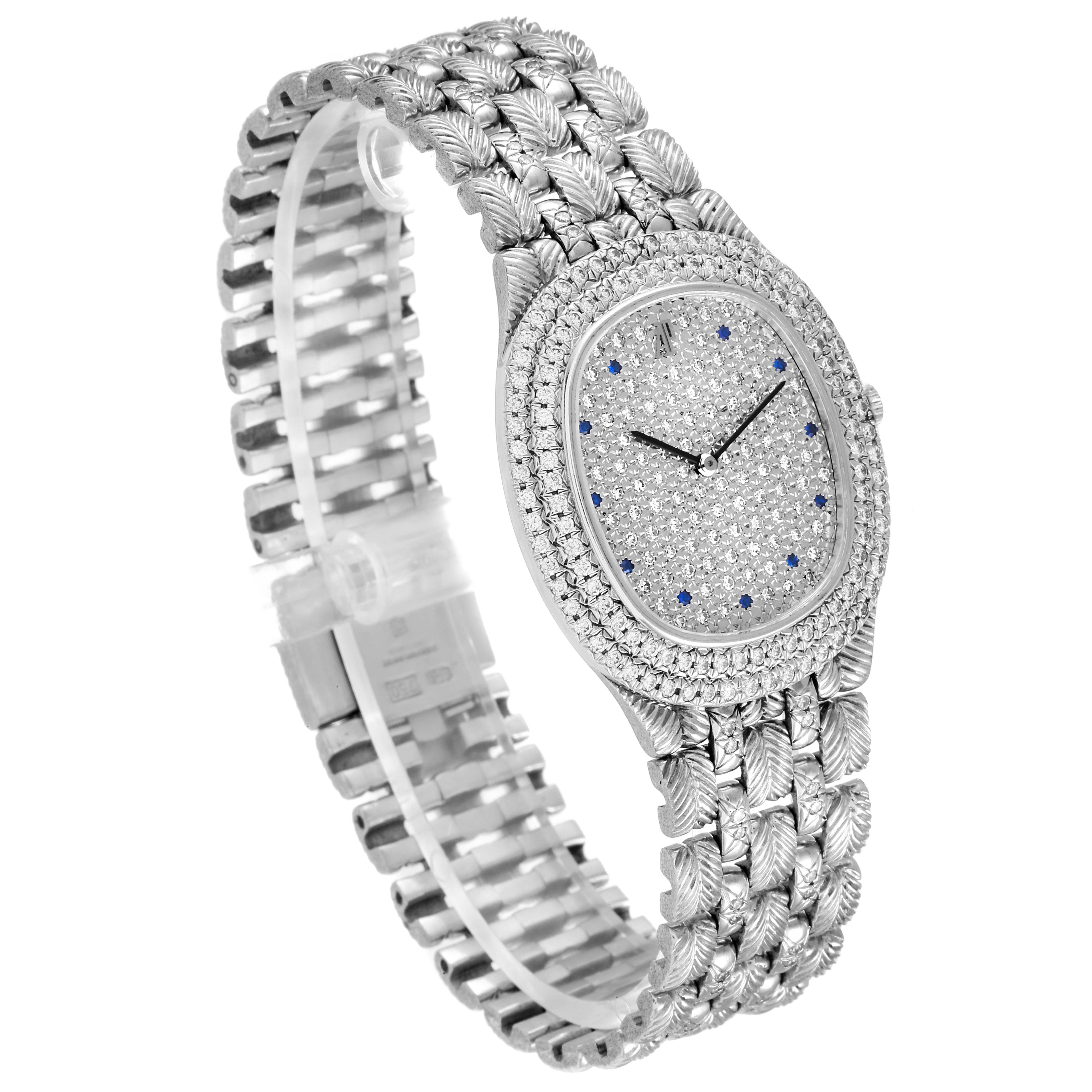 The image shows an angled view of an Audemars Piguet Vintage 56478 Men's White Gold  56478 Men's White Gold  watch, highlighting its diamond-encrusted dial and intricate bracelet.