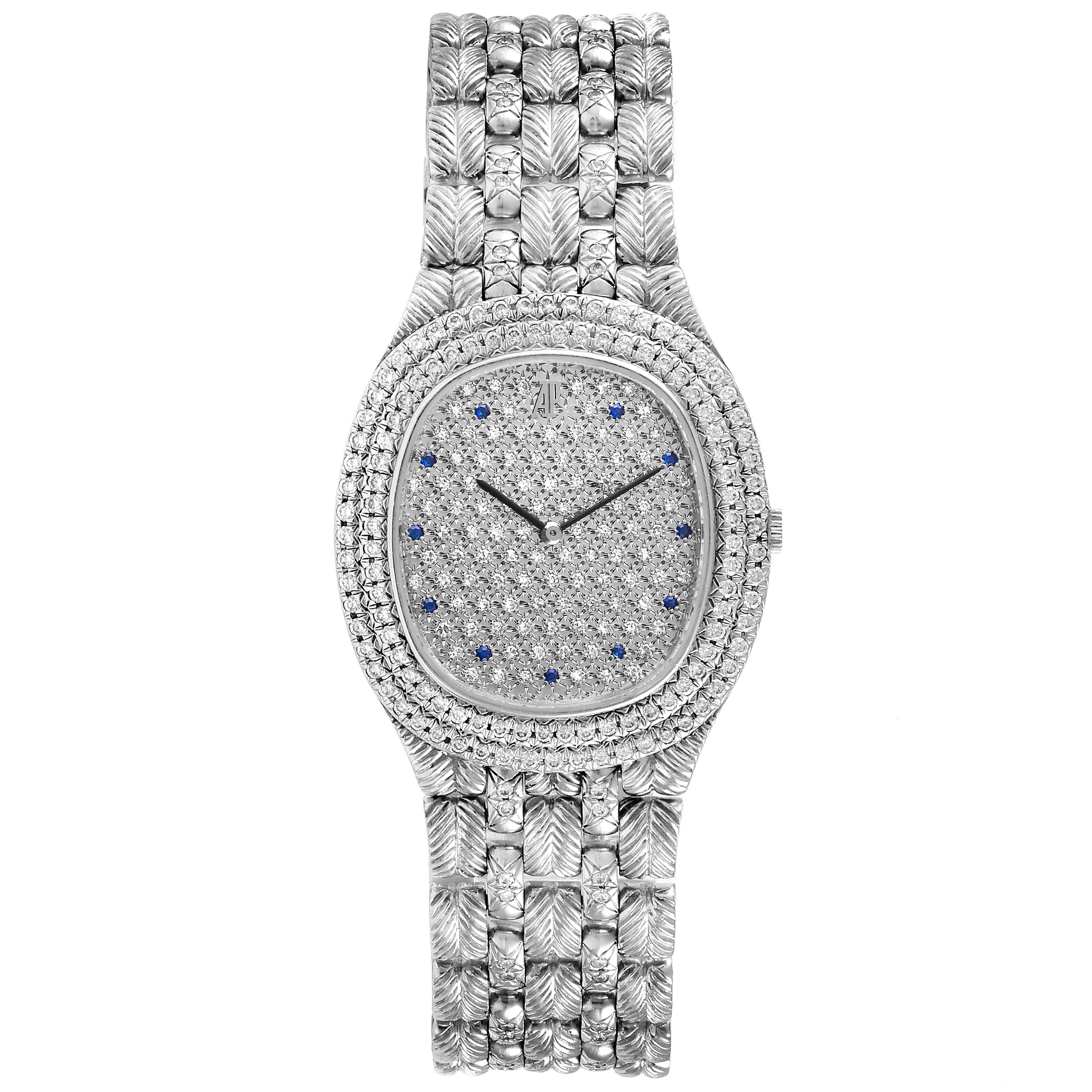 This image shows a full frontal view of a vintage Audemars Piguet watch with a diamond-studded face and bracelet.