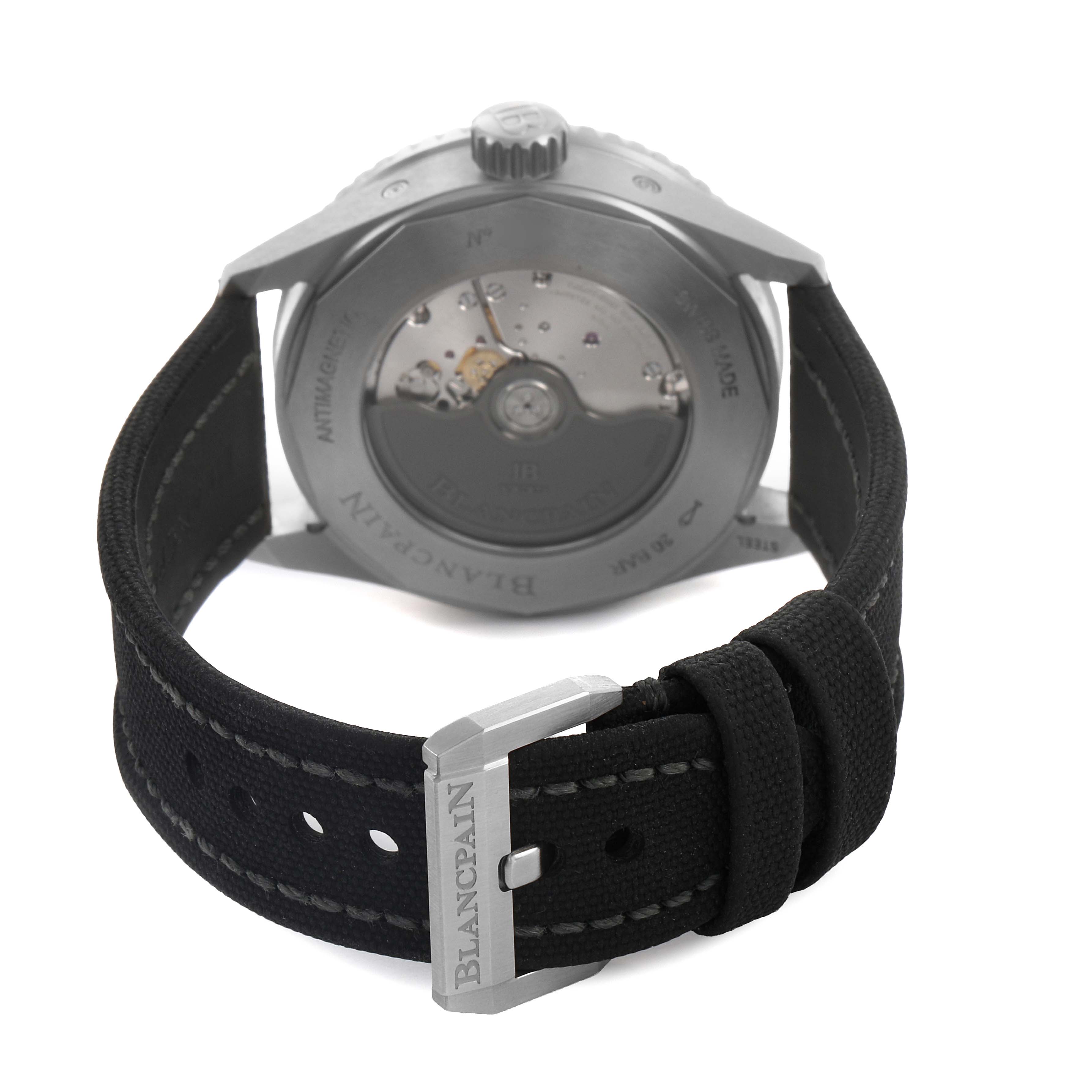 The image shows the back view of a Blancpain Fifty Fathoms 5054 1110 B52A Men's Stainless Steel Grey Dial watch, highlighting the automatic movement and strap with buckle.