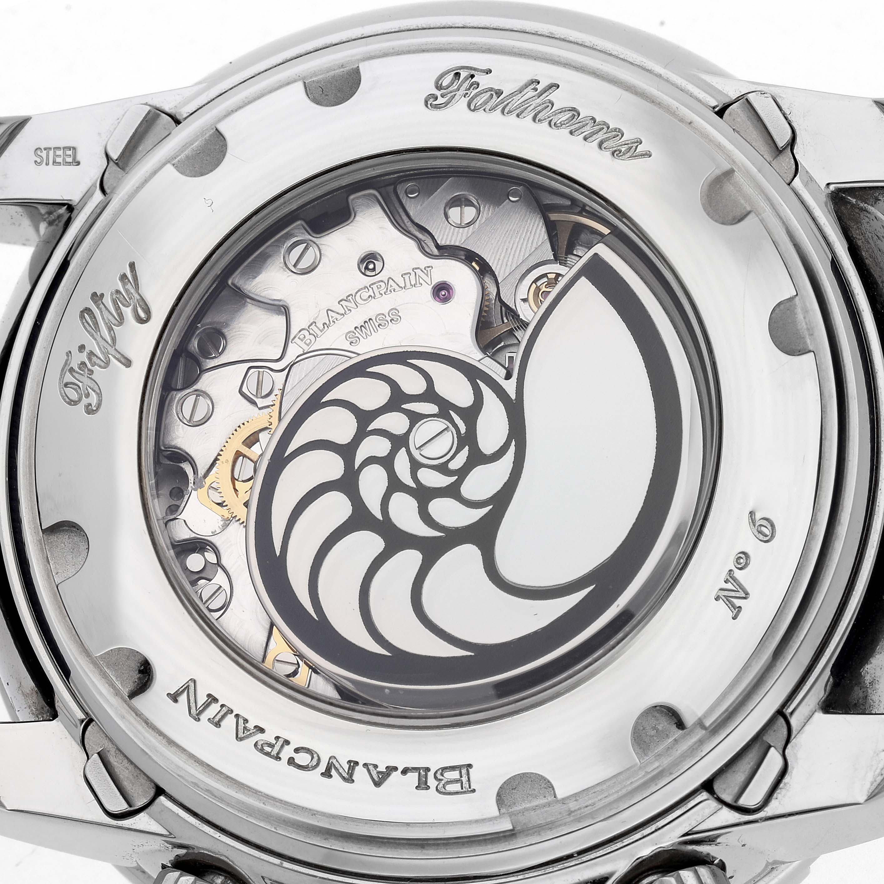 The image shows the case back of a Blancpain Fifty Fathoms model 5066F-1140-52B, highlighting its mechanical movement and decorative elements.