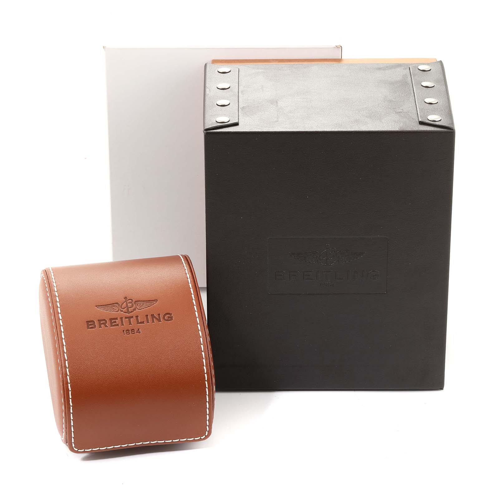 The image shows a Breitling Superocean A17391 Men's Stainless Steel Black Dial A17391 Men's Stainless Steel Black Dial watch box and a brown watch case with the Breitling logo.