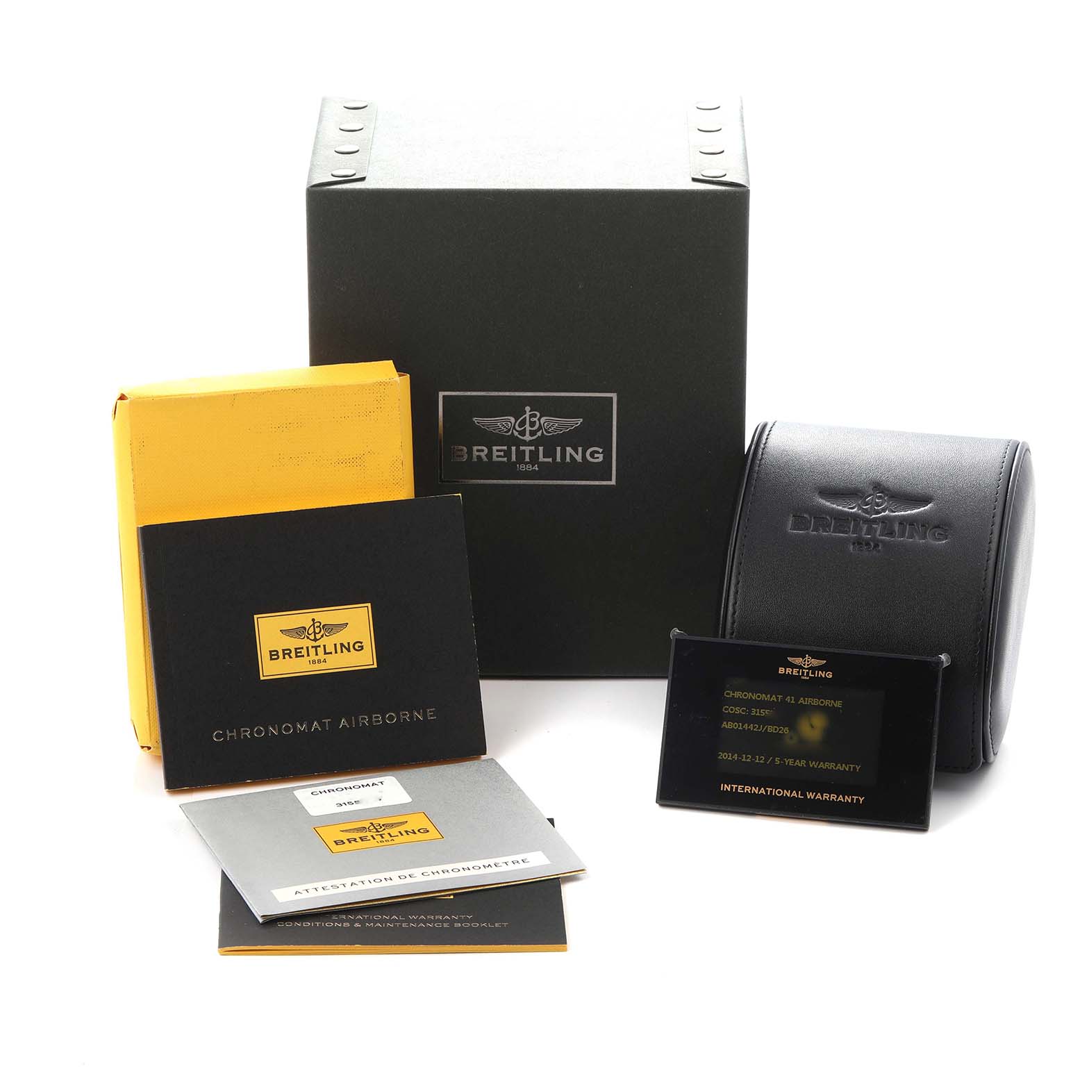 The image shows the accessories for the Breitling Chronomat model AB0144, including a box, warranty card, manuals, and a watch case.
