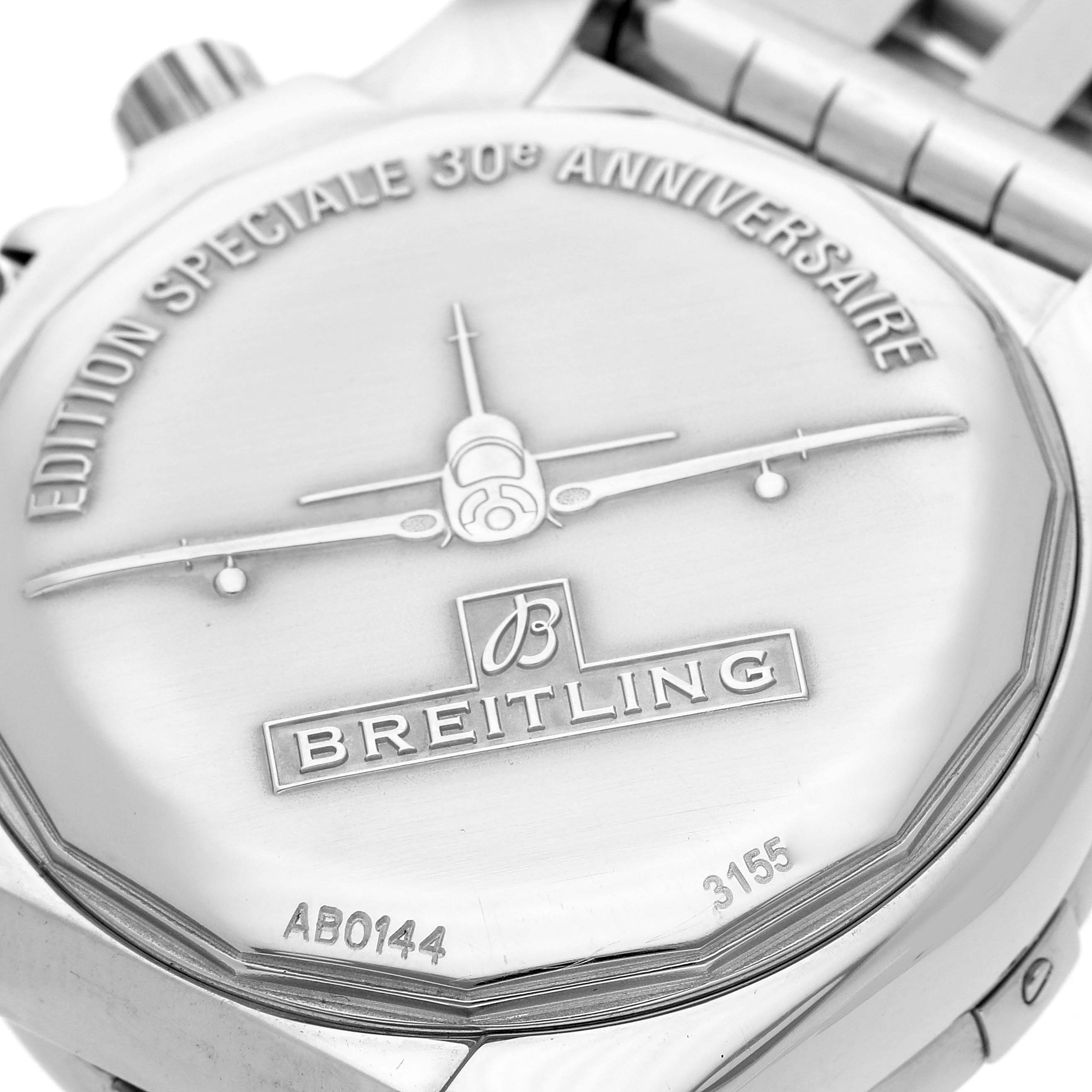 The image shows the back case of a Breitling Chronomat men's watch, model AB0144, featuring an engraved airplane and anniversary edition text.