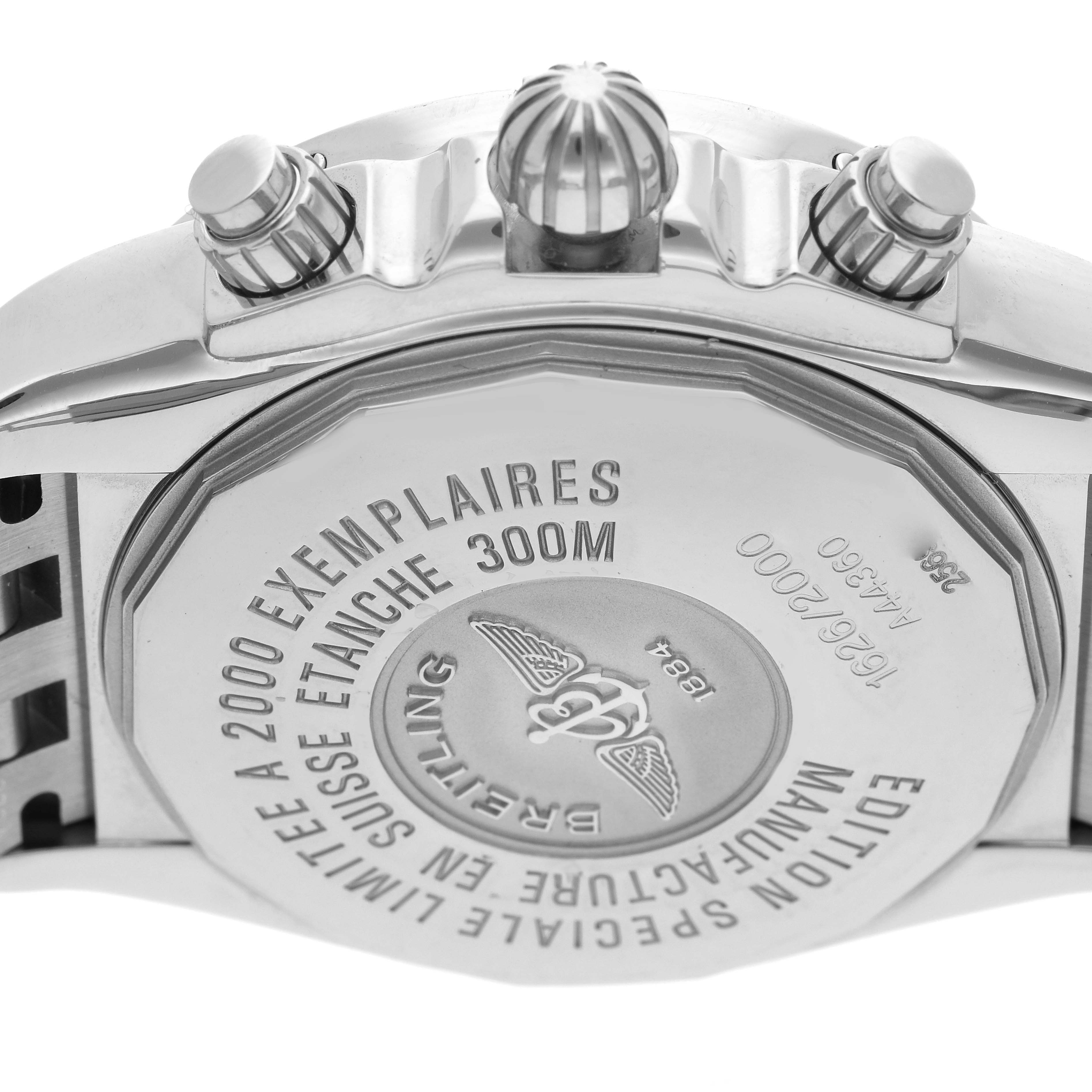 The image shows the back case of a Breitling Chronomat A44360 men's watch, highlighting the engraved details and pushers on the side.