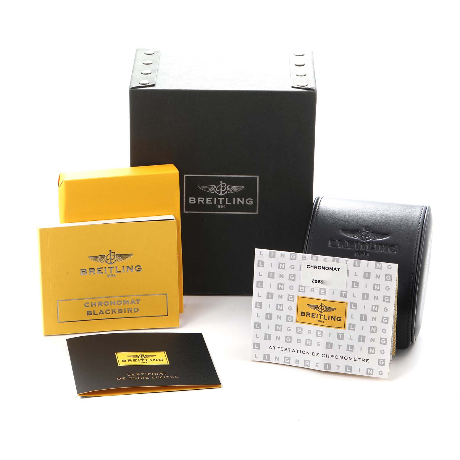 The image shows the packaging and accessories for a Breitling Chronomat model A44360, including boxes and booklets with the brand's logo.