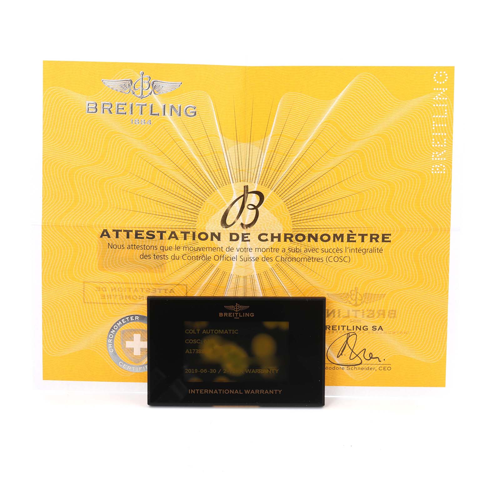 The image shows warranty documentation and a chronometer certificate for a Breitling Colt model, model number A17388, men's watch.