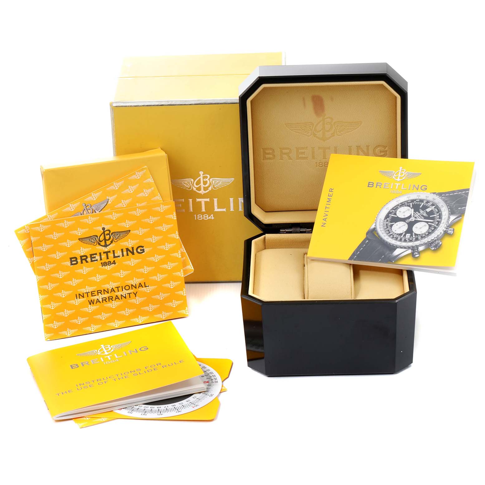 The image shows the Breitling Navitimer A23322 Men's Stainless Steel Silver Dial A23322 Men's Stainless Steel Silver Dial watch box, manuals, and international warranty card.