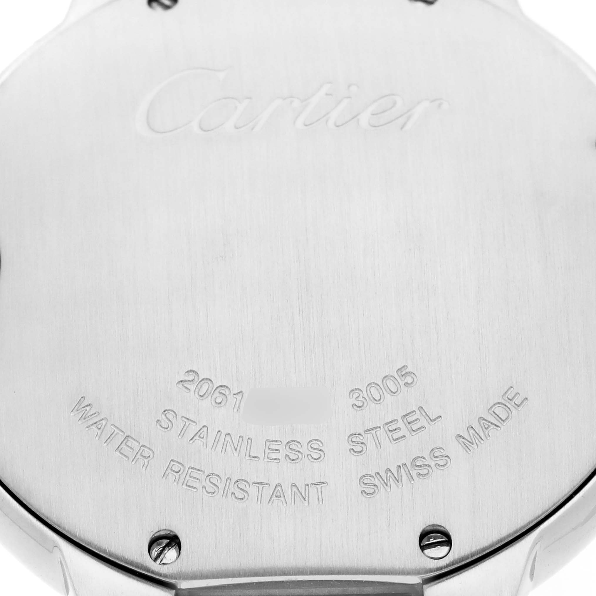 The image shows the back of a Cartier Ballon Bleu W69008Z3 men's watch, highlighting its stainless steel back with engraved details and screws.