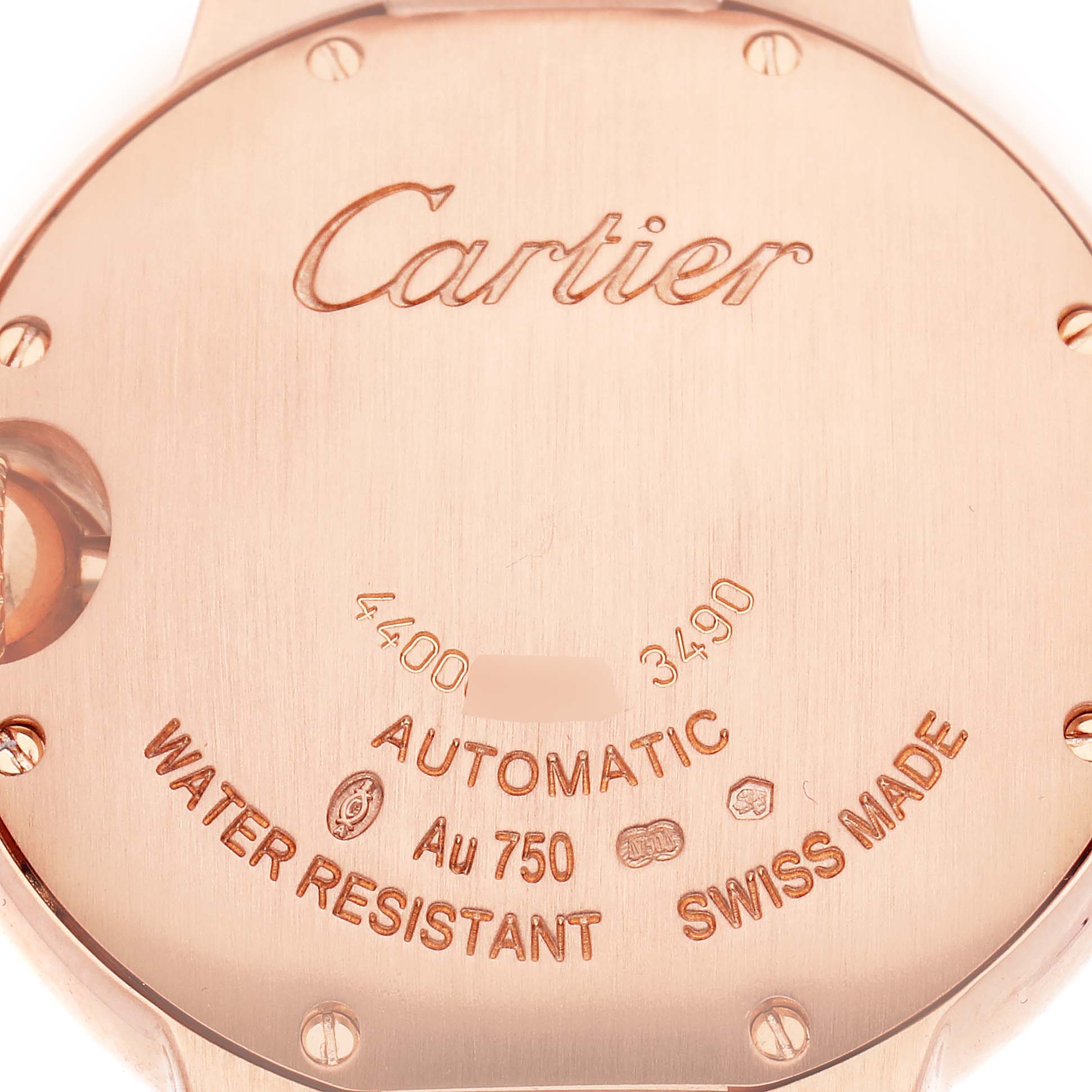 The image shows the back of the Cartier Ballon Bleu Men
s watch, model W6920096, highlighting engravings like "Automatic" and "Swiss Made."