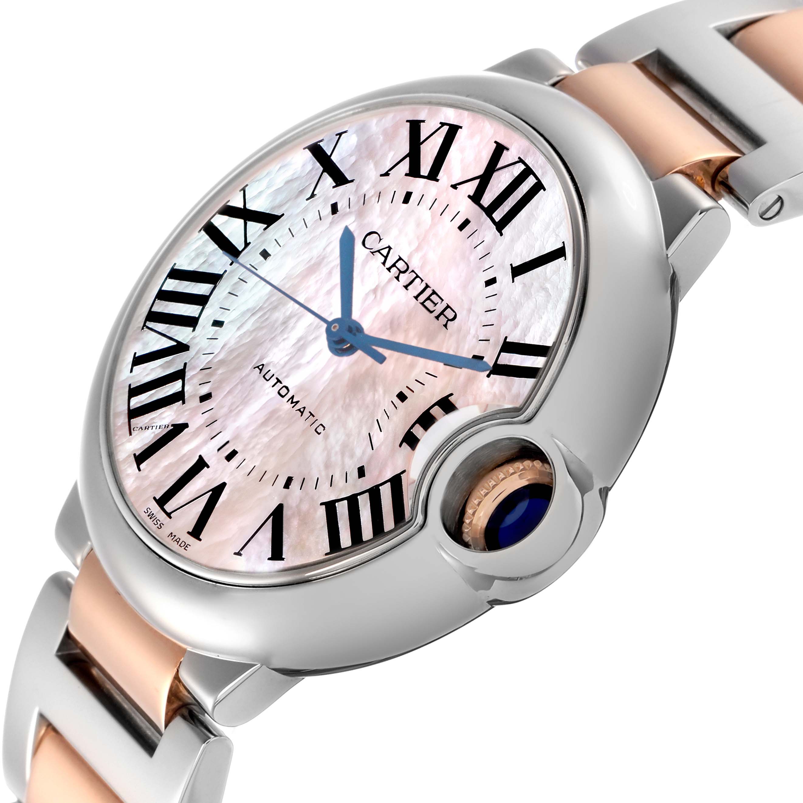 The Cartier Ballon Bleu model W6920033 is shown at an angled side view, highlighting the pink dial, blue hands, and metal bracelet with a combination of silver and rose gold.