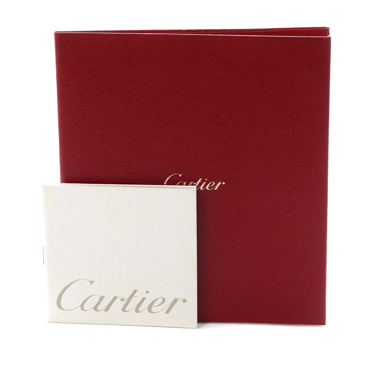 The image shows the packaging for a Cartier Ballon Bleu model W6920033 men's watch, featuring a red case and a white booklet with the Cartier logo.