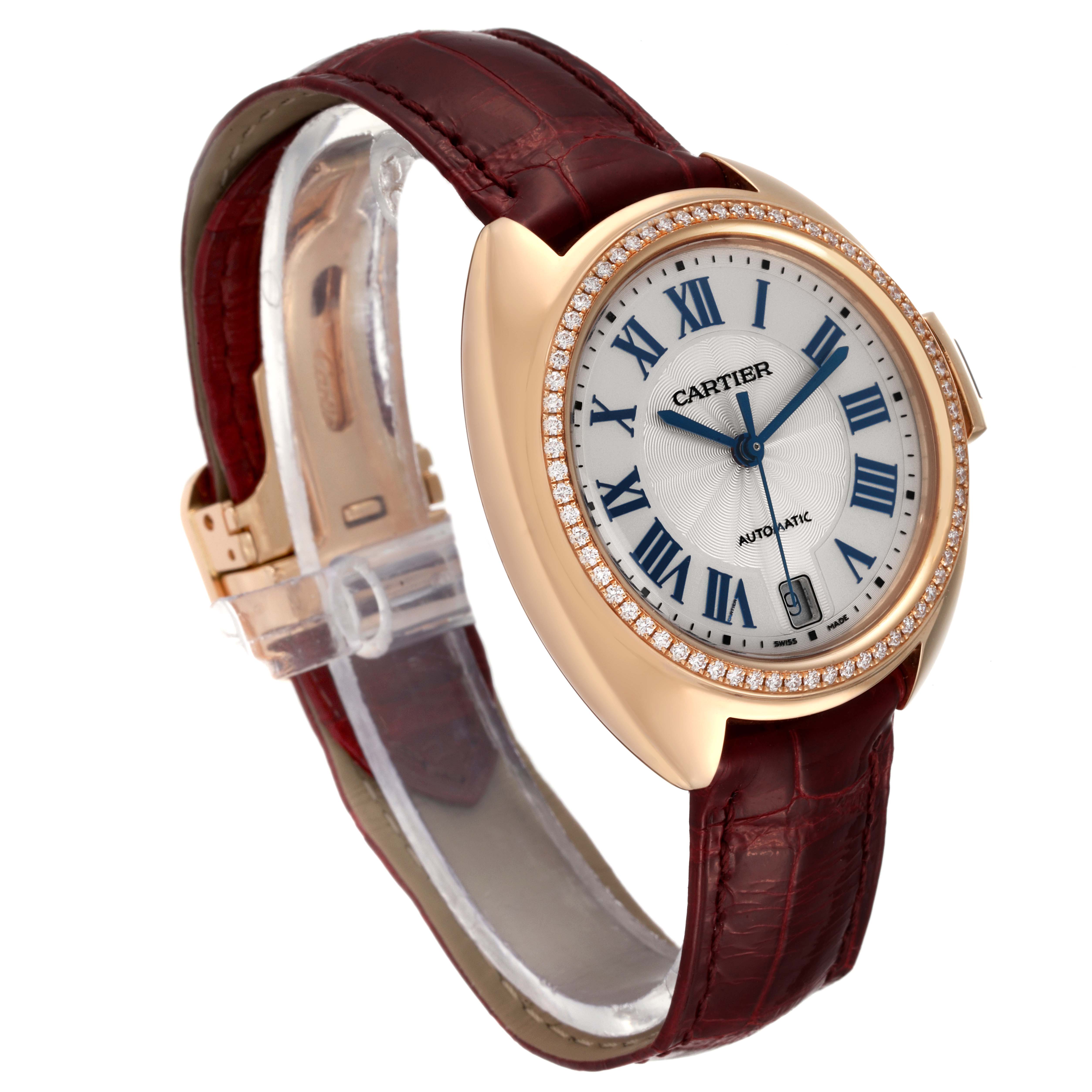 The Cartier Cle WJCL0013 Women's Rose Gold Blue Dial WJCL0013 Women's Rose Gold Blue Dial model watch is shown at a three-quarter angle, highlighting the face, diamond bezel, and leather strap.