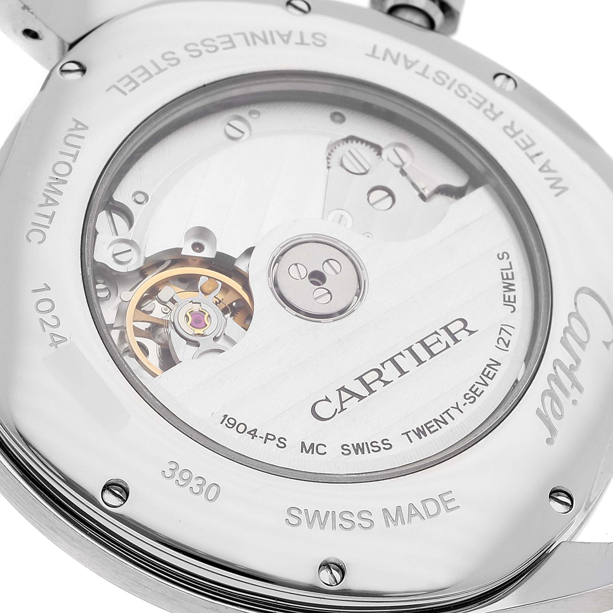 The image shows the back of the Drive de Cartier watch by Cartier, highlighting its internal mechanism and inscriptions.