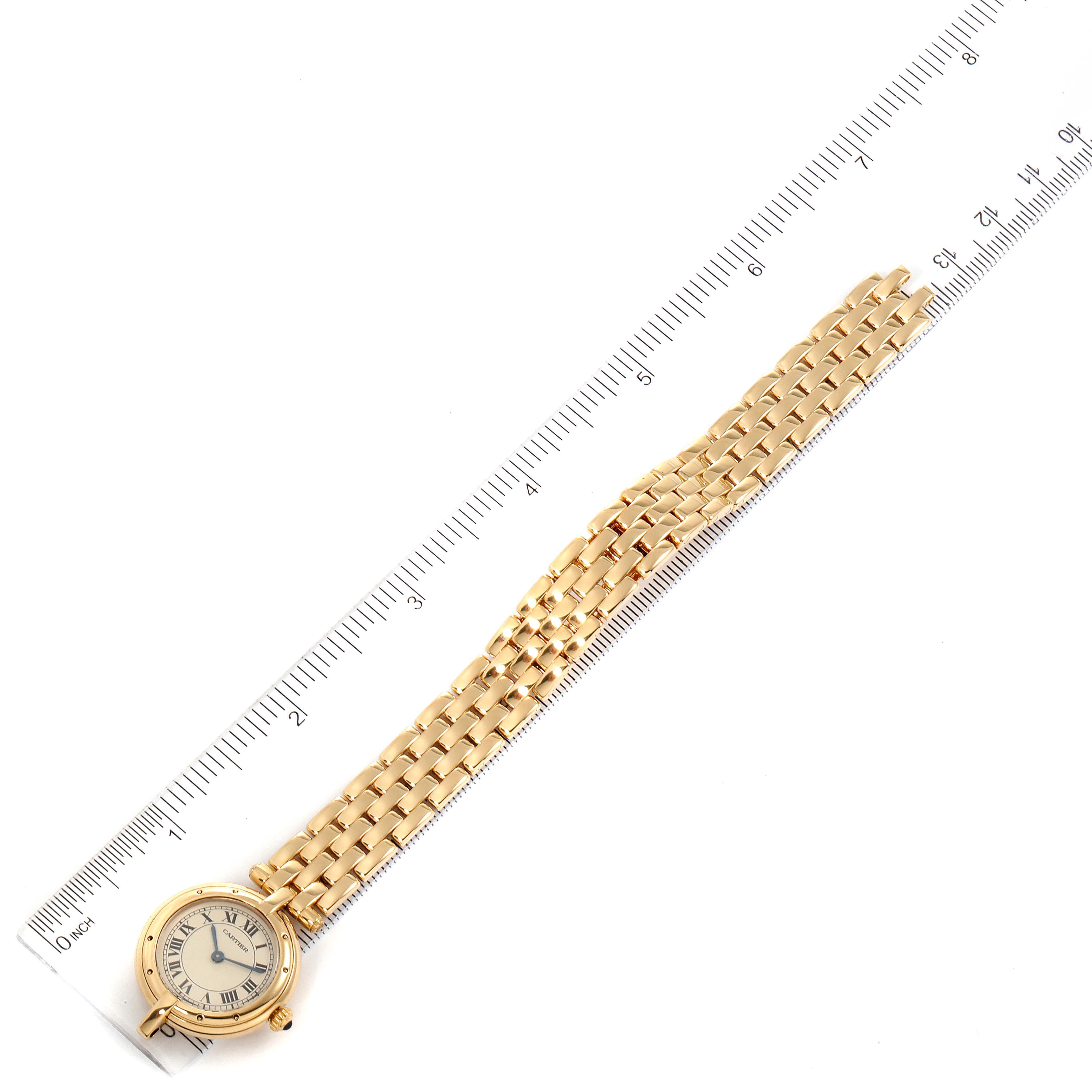 The image shows a Panthere model by Cartier, displayed flat alongside a ruler, showcasing the watch face and full band length.