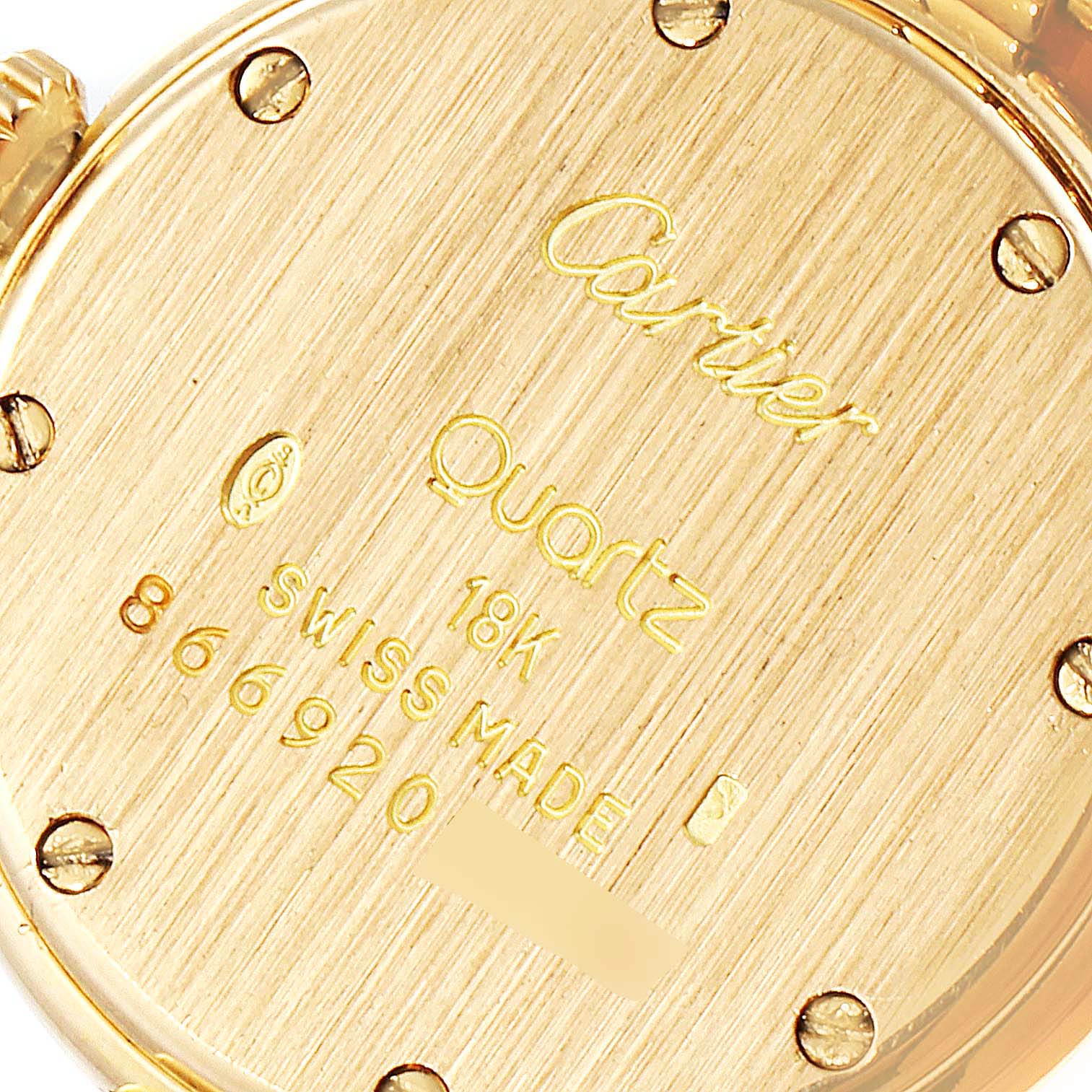 This image shows the back of the Cartier Panthere 6692 Women's Yellow Gold Silver Dial 6692 Women's Yellow Gold Silver Dial watch, highlighting the engraved model details and screws.