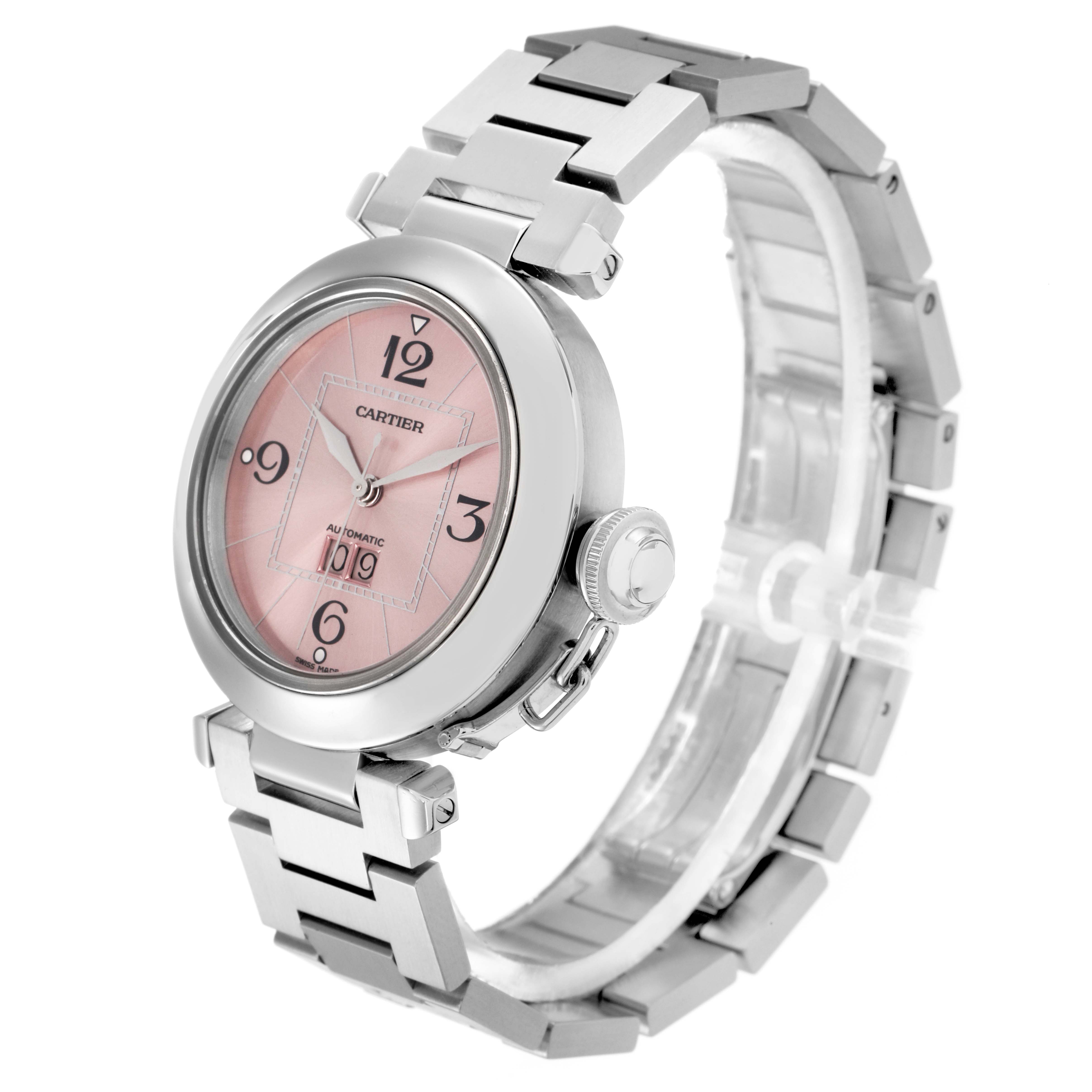 The Cartier Pasha model W31058M7 is shown at a three-quarter angle, highlighting the pink dial, silver case, and bracelet.