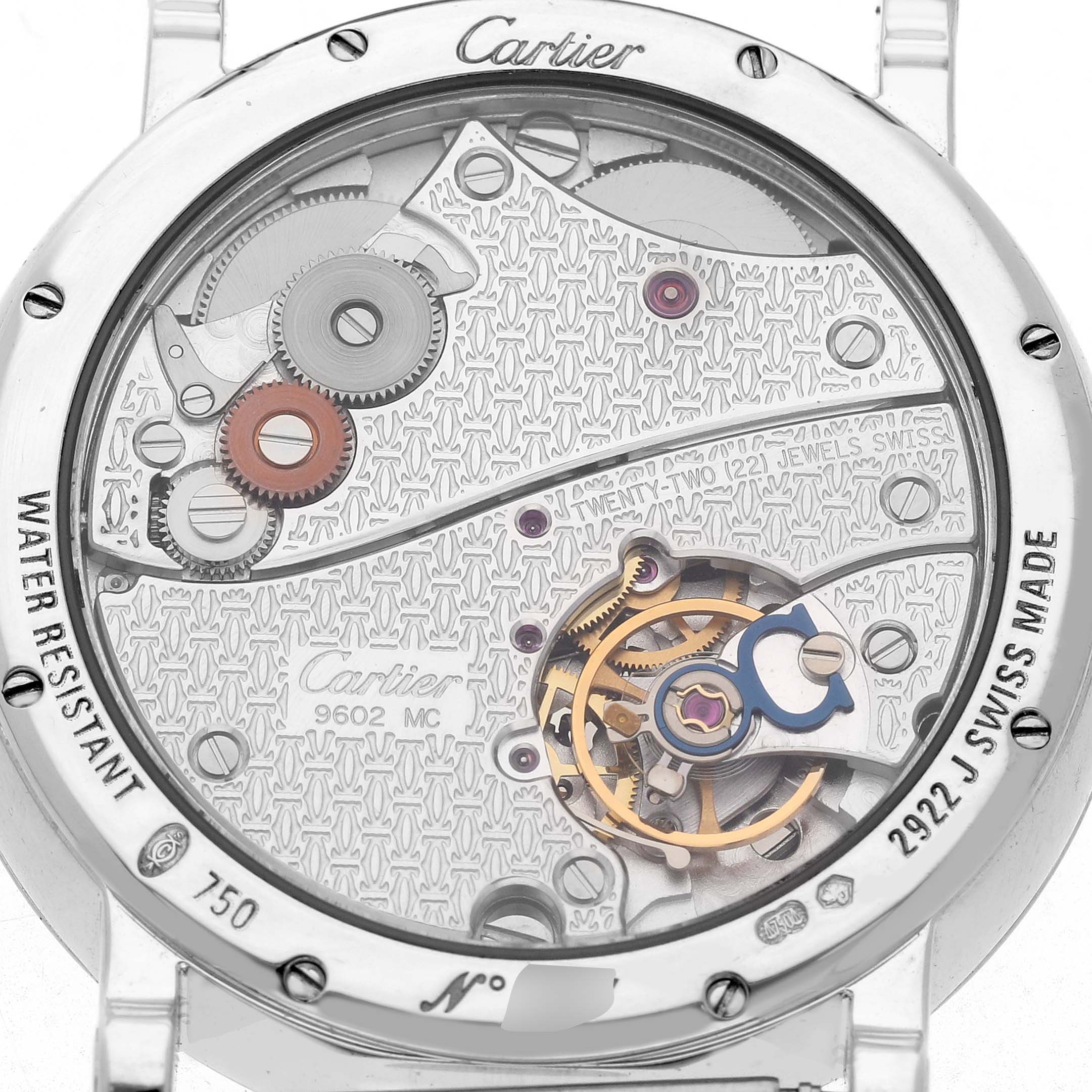 The image shows the back view of a Cartier Rotonde W1552851 Men's White Gold Silver Dial watch, highlighting its intricate mechanical movement and gears.