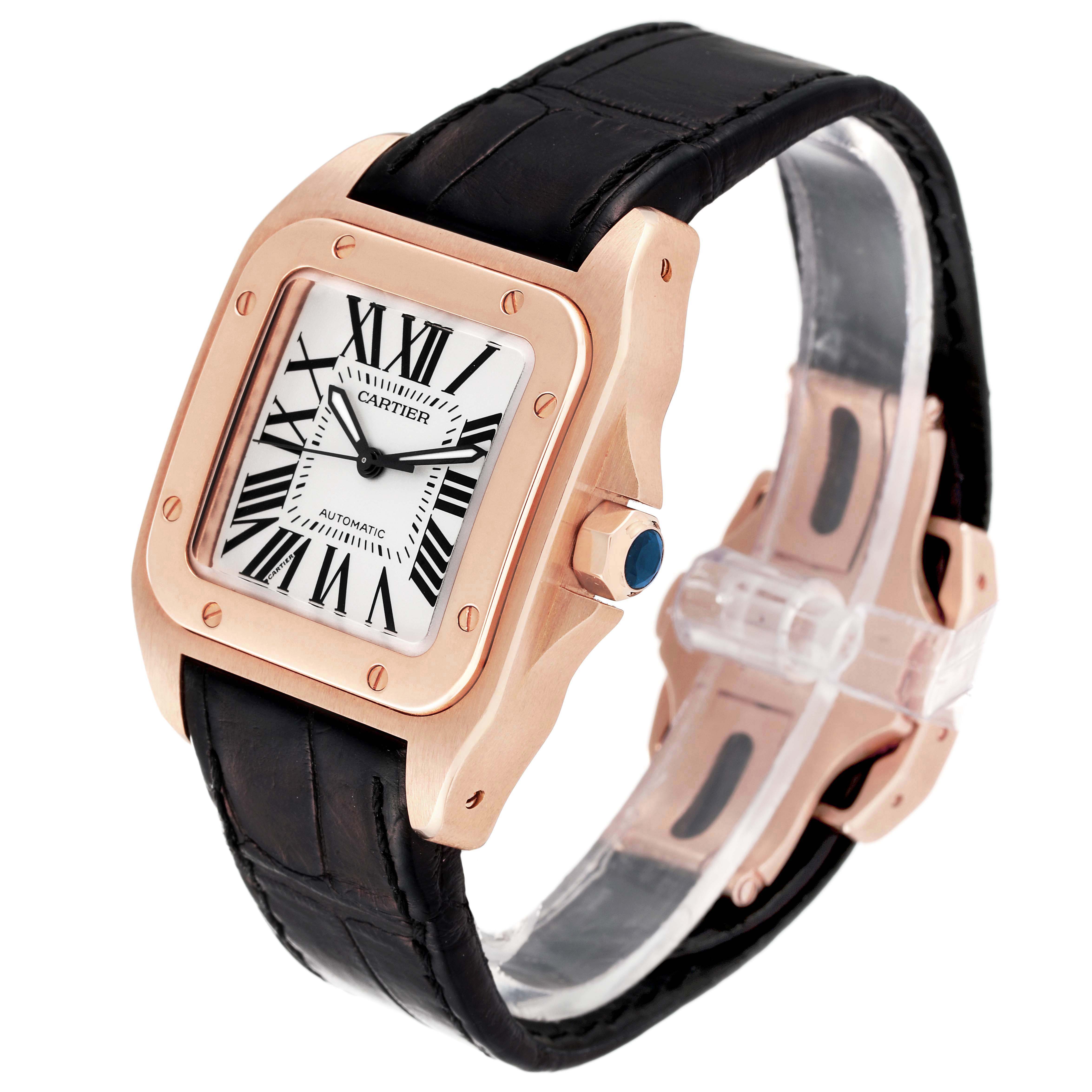 The image shows a Cartier Santos W20108Y1 Men's Rose Gold Silver Dial W20108Y1 Men's Rose Gold Silver Dial watch at an angle revealing its rose gold case, black strap, and clear dial with Roman numerals.