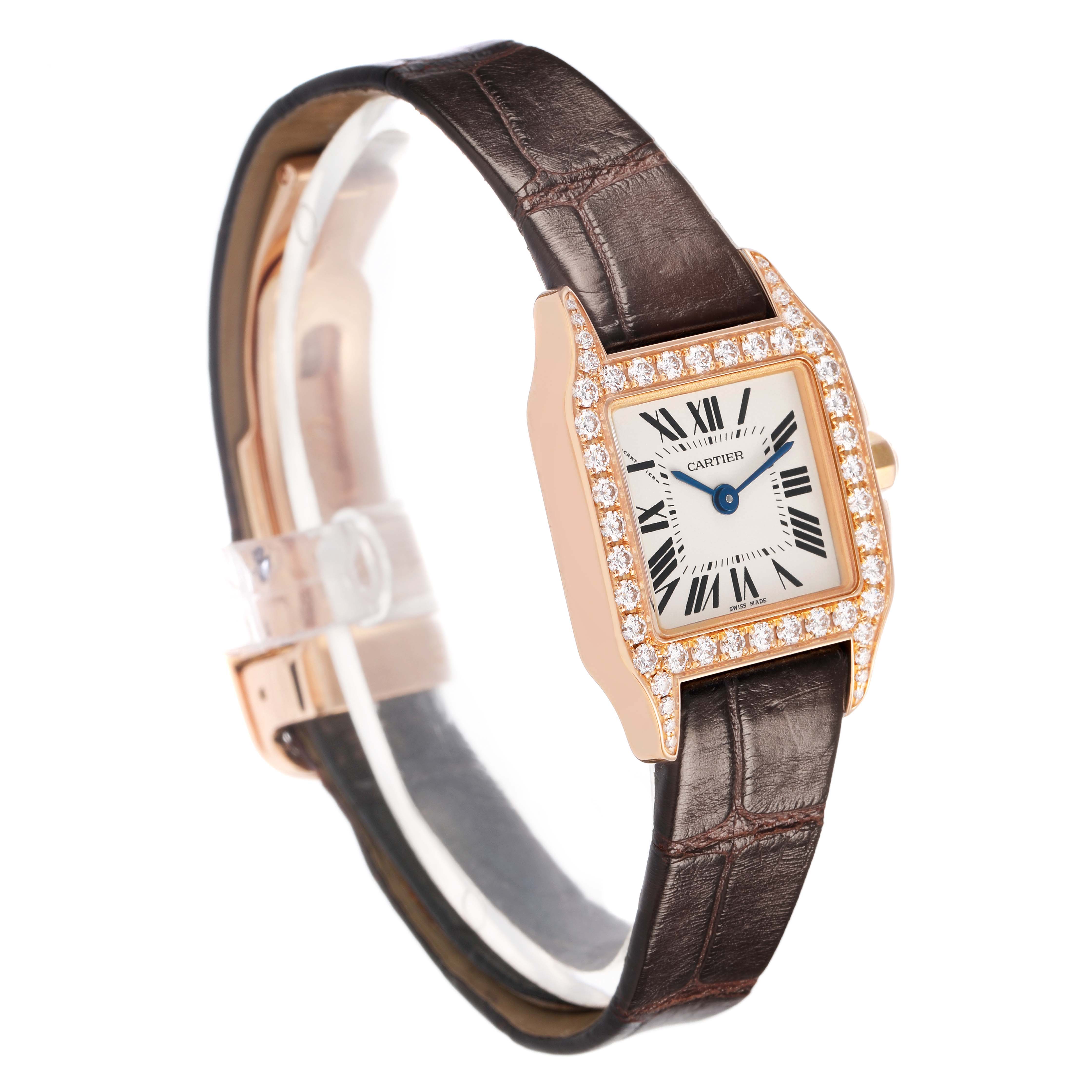 The Cartier Santos Demoiselle WF902006 Women's Rose Gold Silver Dial watch is shown at a three-quarter angle, highlighting its diamond-encrusted bezel and leather strap.