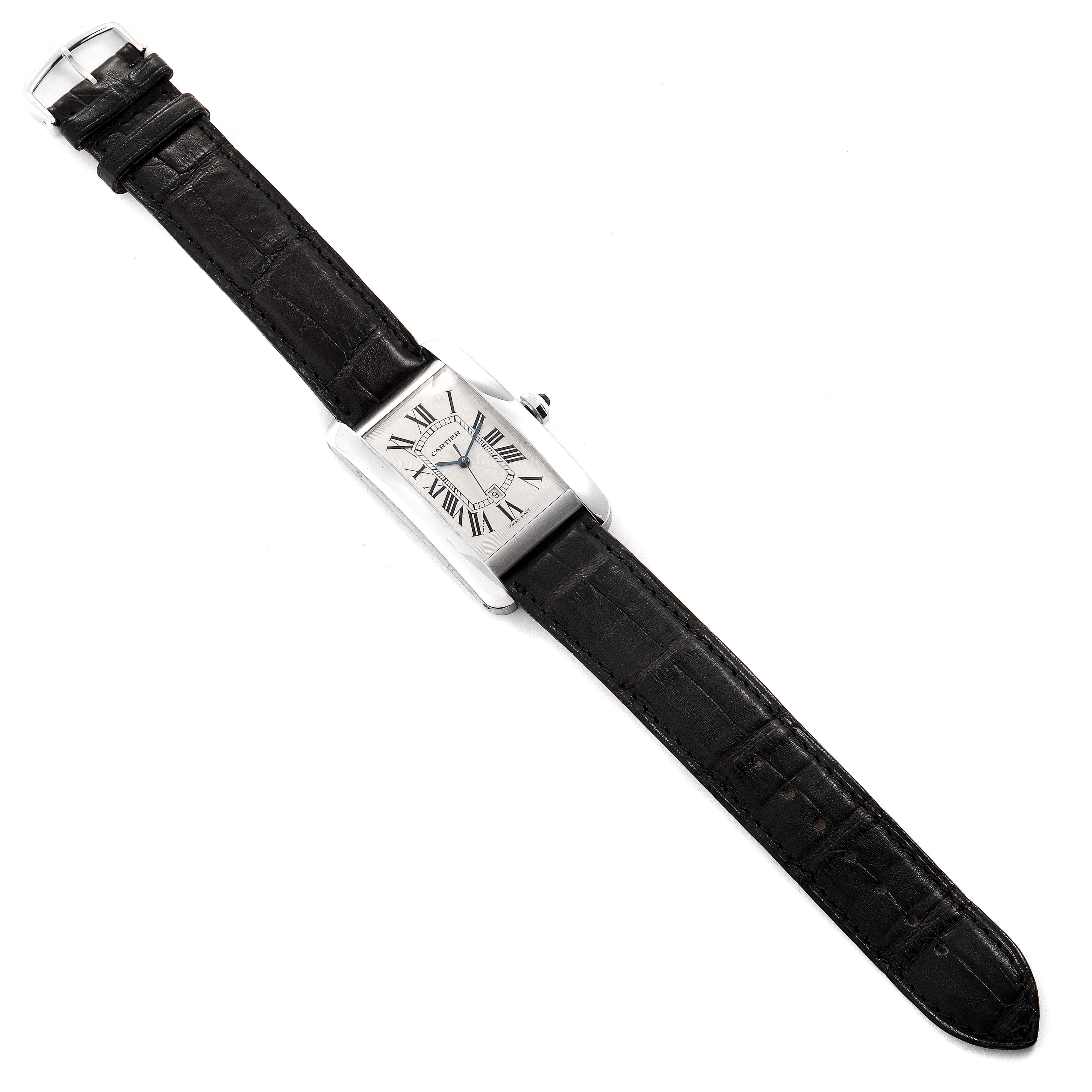 The image shows a top-down view of a Cartier Tank Américaine watch with a black leather strap.