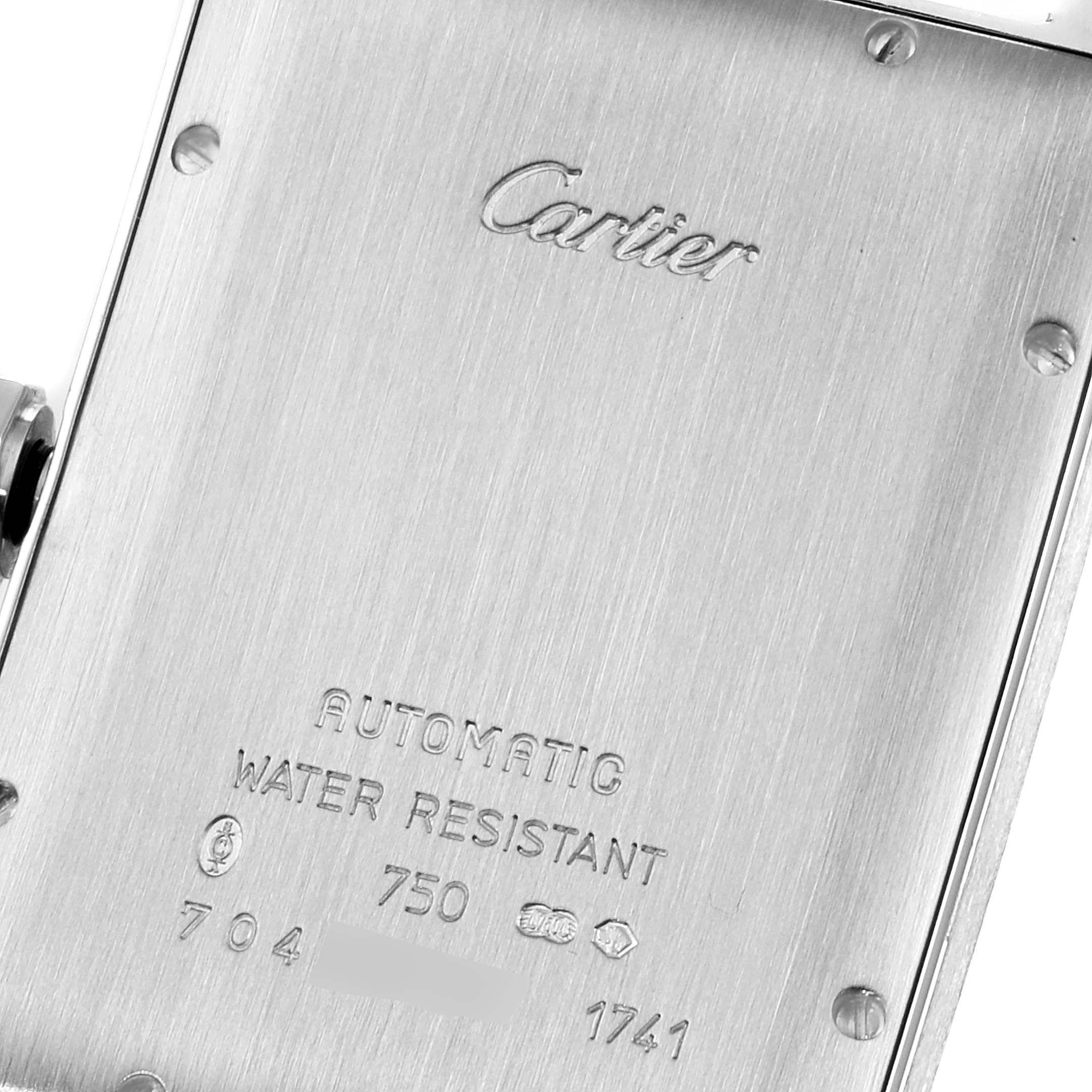 The image shows the back casing of a Cartier Tank Americaine W2603256 Men
s Stainless Steel Silver Dial W2603256 Men
s Stainless Steel Silver Dial watch, featuring the brand engraving and model specifications.