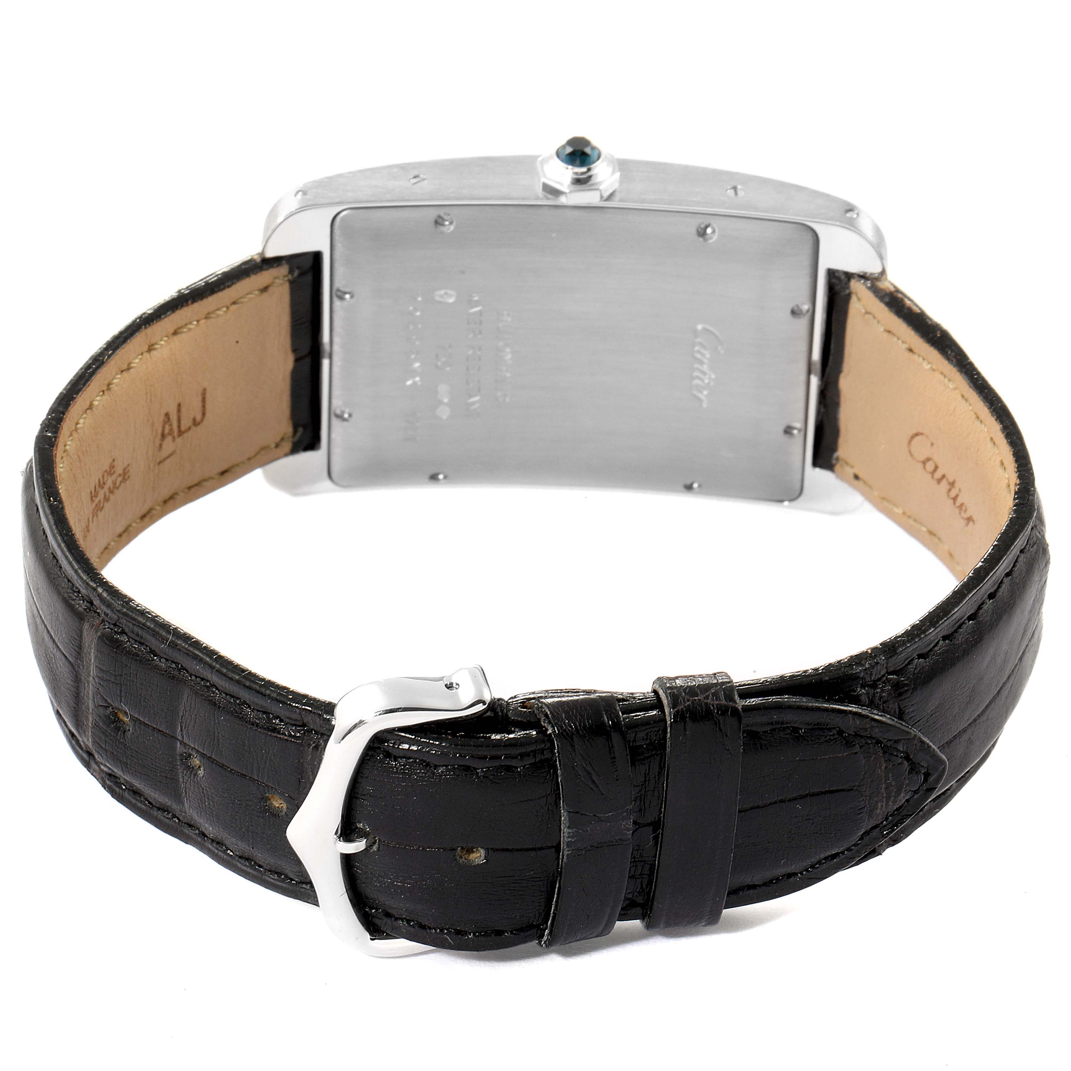 This image shows the back case, crown, and leather strap of a Cartier Tank Americaine W2603256 Men
s Stainless Steel Silver Dial W2603256 Men
s Stainless Steel Silver Dial watch.