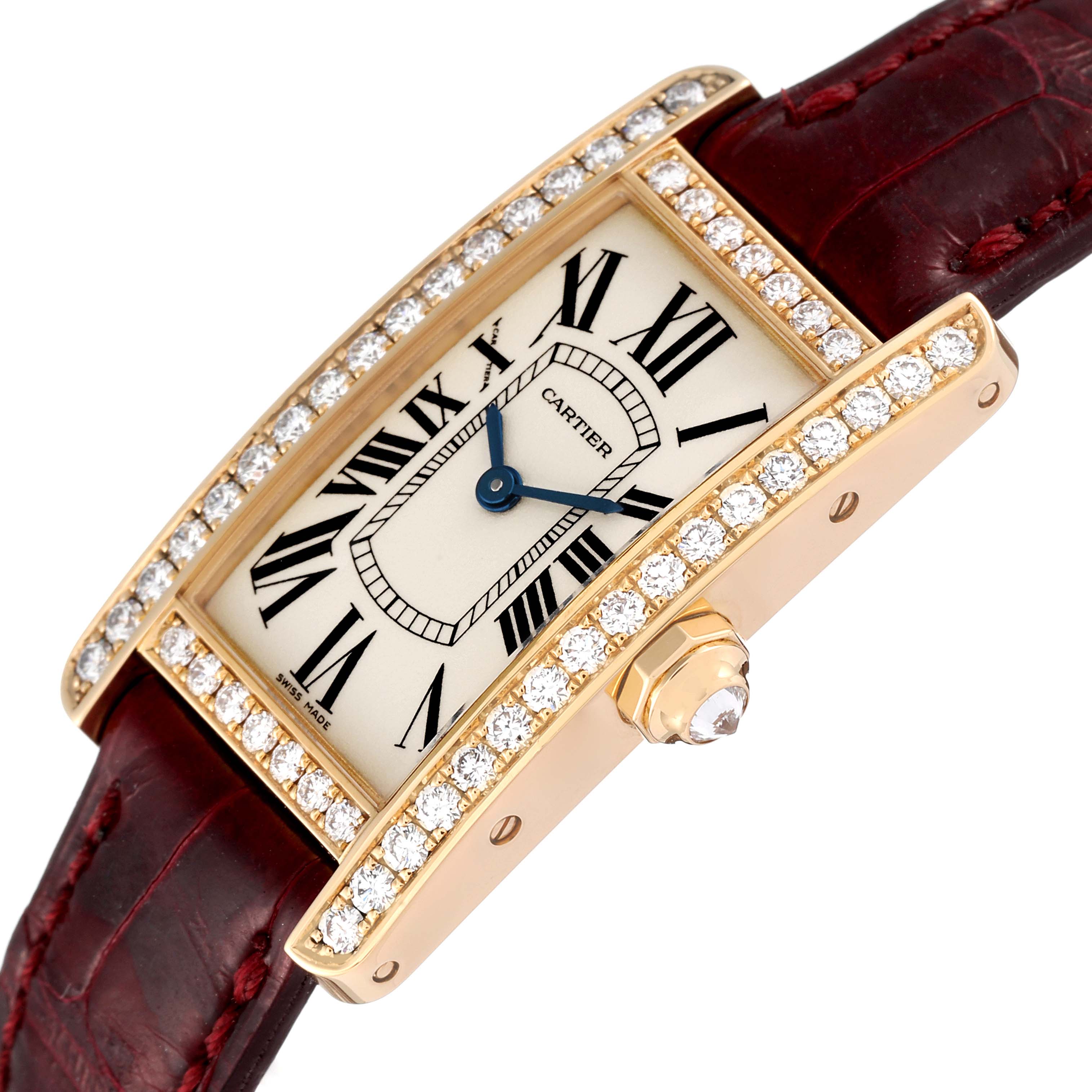 The Cartier Tank Americaine WB707231 Women's Yellow Gold Silver Dial WB707231 Women's Yellow Gold Silver Dial watch is shown at an angled view, highlighting its diamond-set bezel and burgundy strap.