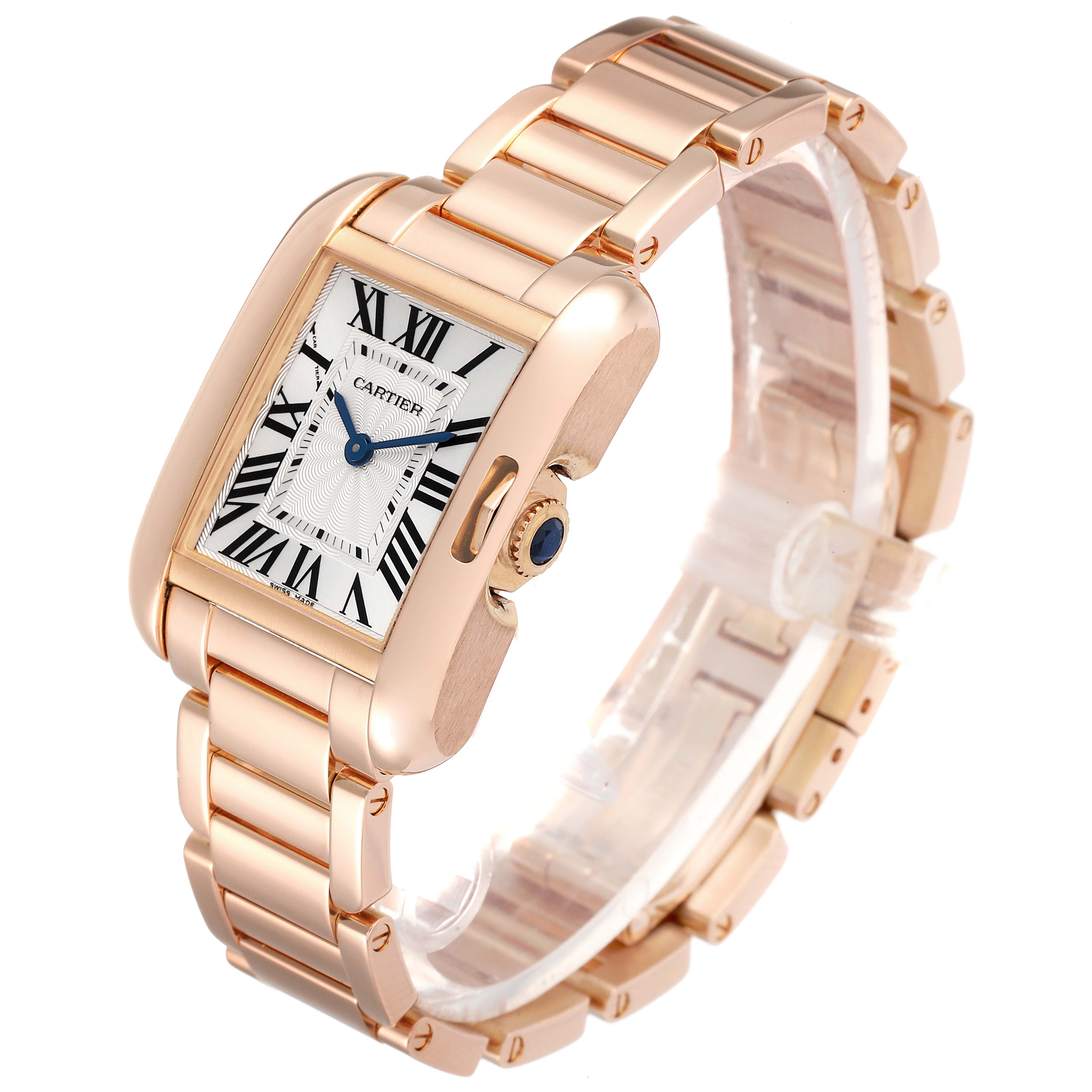 The Cartier Tank Anglaise W5310013 Women
s Rose Gold Silver Dial W5310013 Women
s Rose Gold Silver Dial watch is shown at an angled side view, highlighting its gold case, bracelet, and crown.