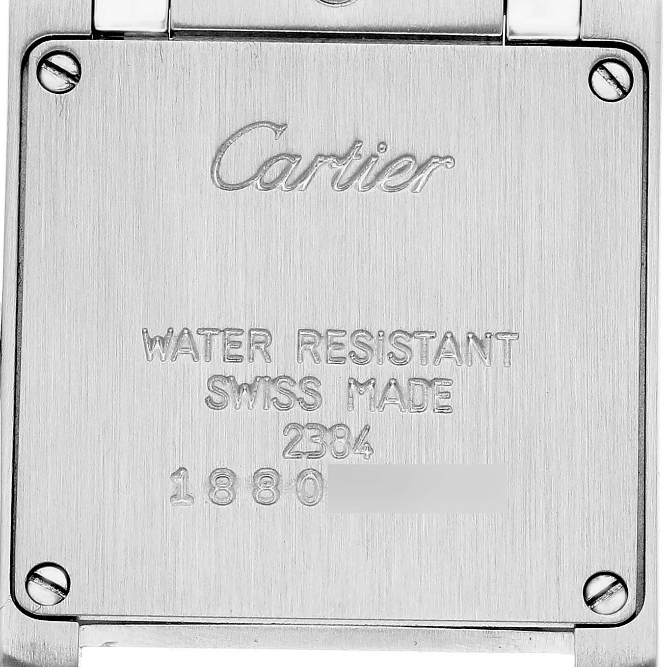 The image shows the back case of a Cartier Tank Francaise W51007Q4 Women's Stainless Steel Silver Dial watch, featuring engraved logos and model details.